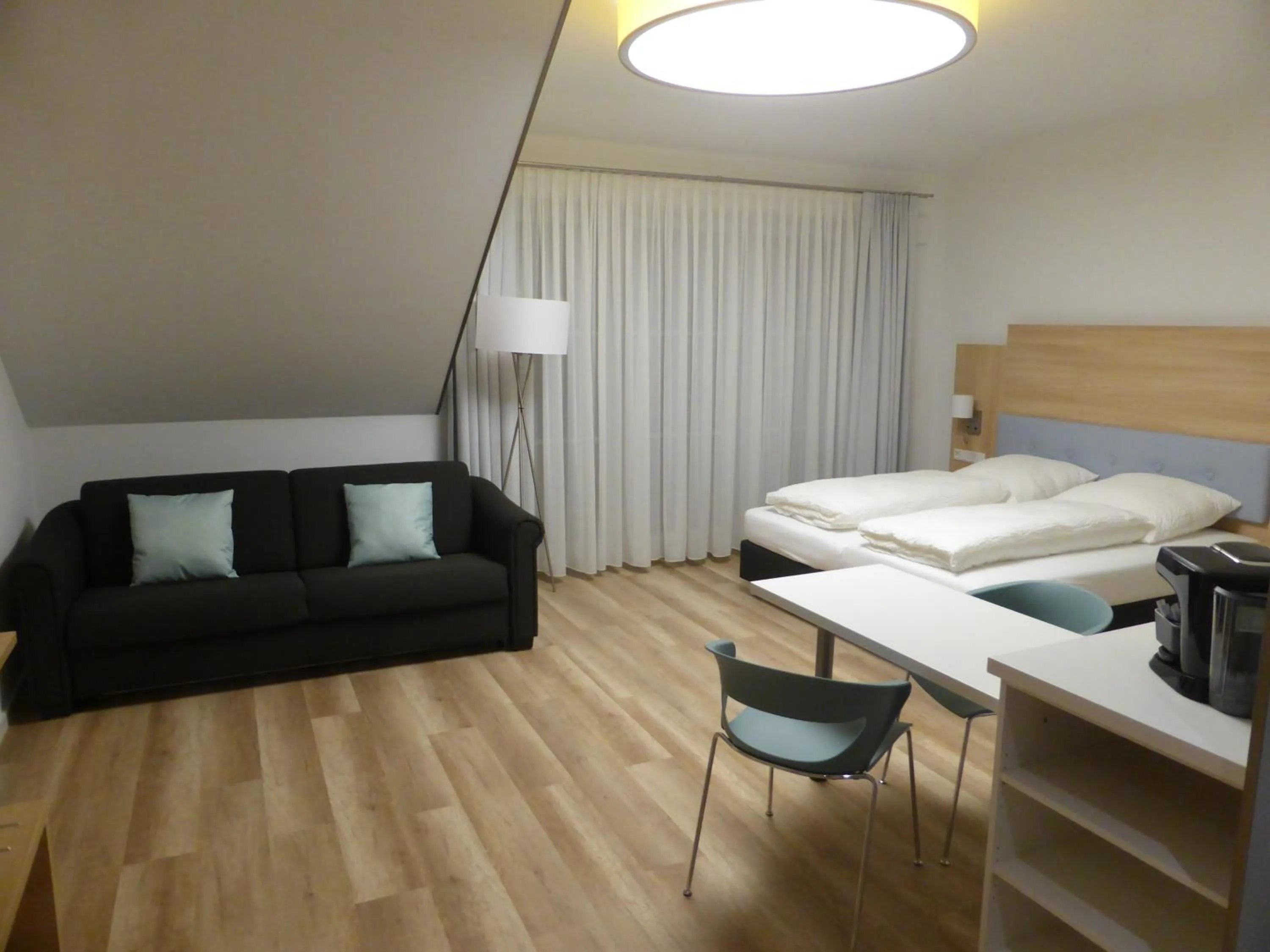 Bed in Leister Apparthotel