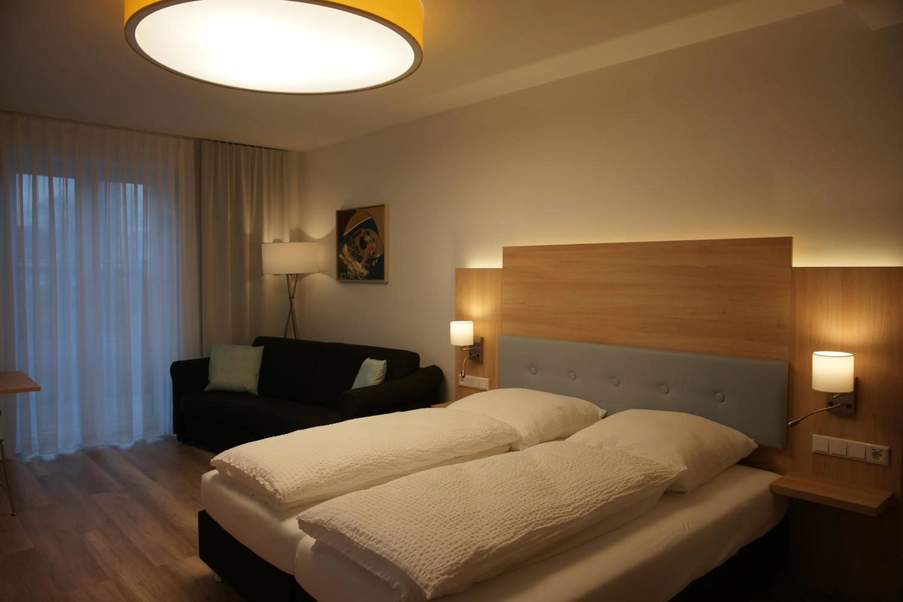 Bed in Leister Apparthotel