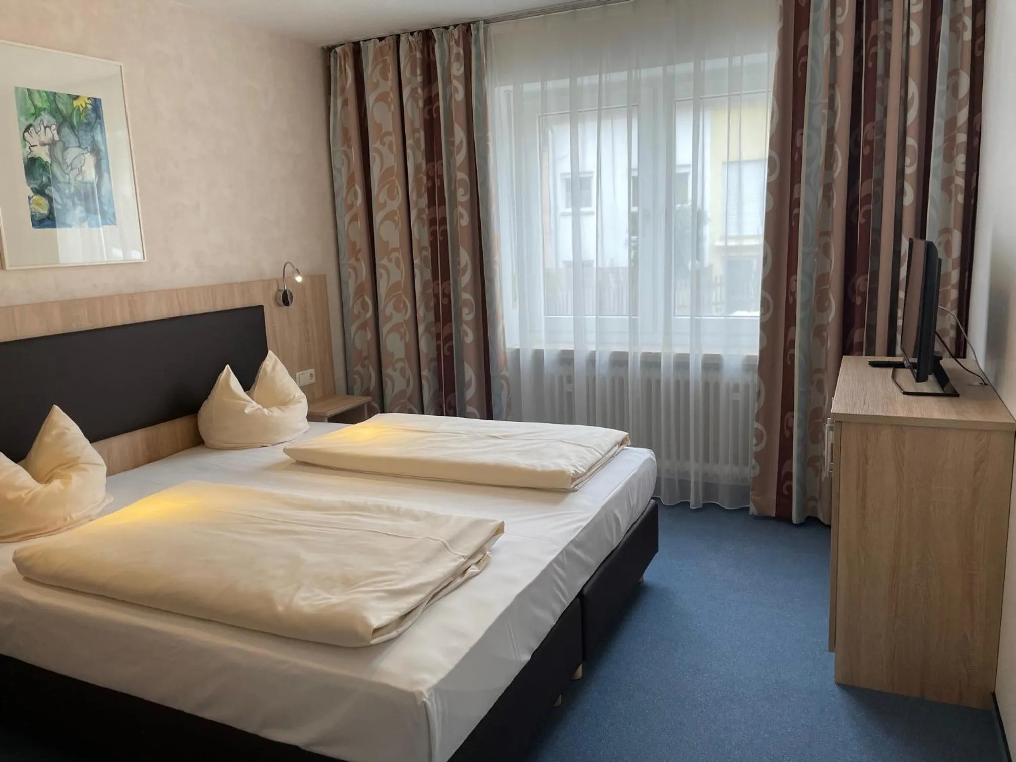 Bed in Hotel Apollo Garni