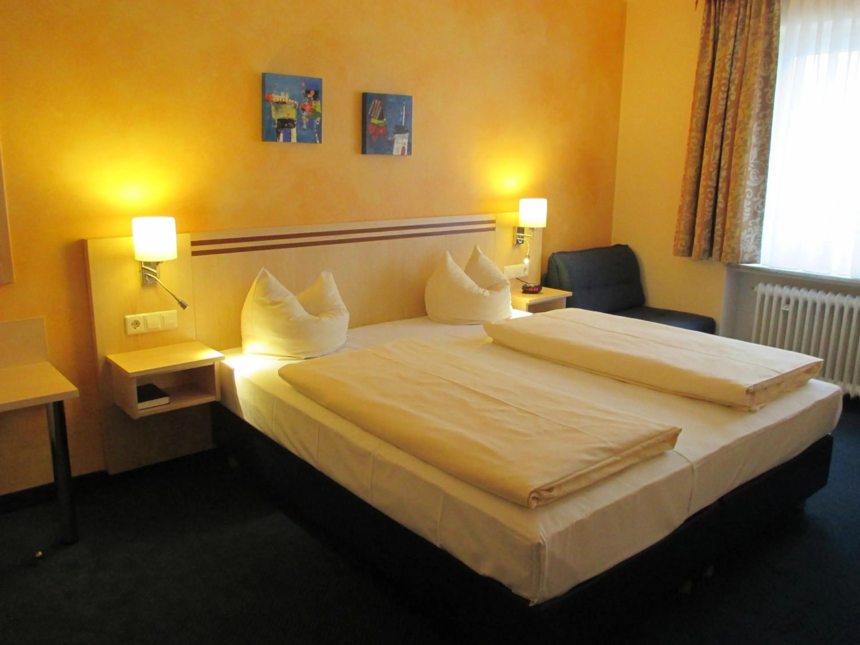 Bed in Hotel Apollo Garni