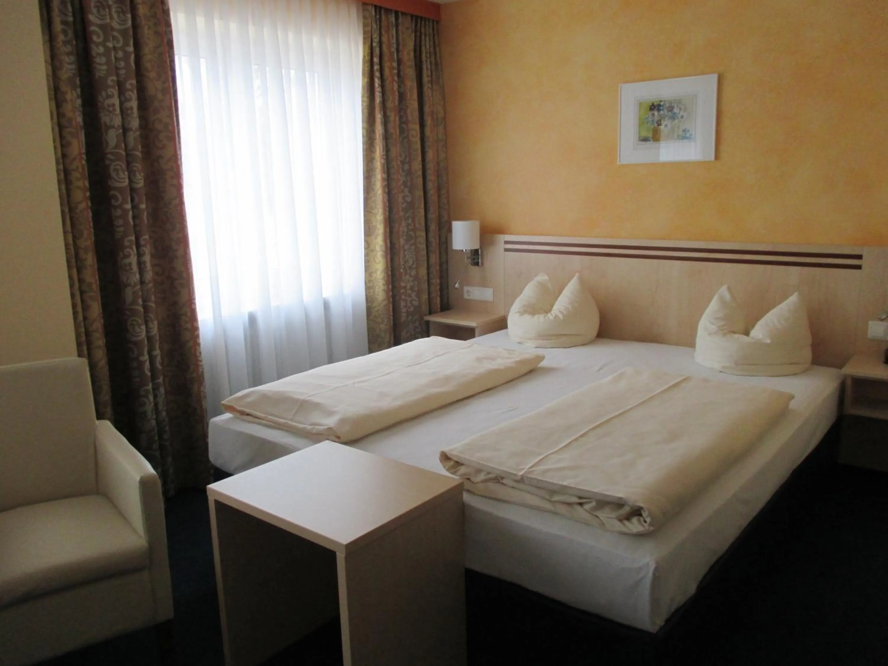 Bed in Hotel Apollo Garni