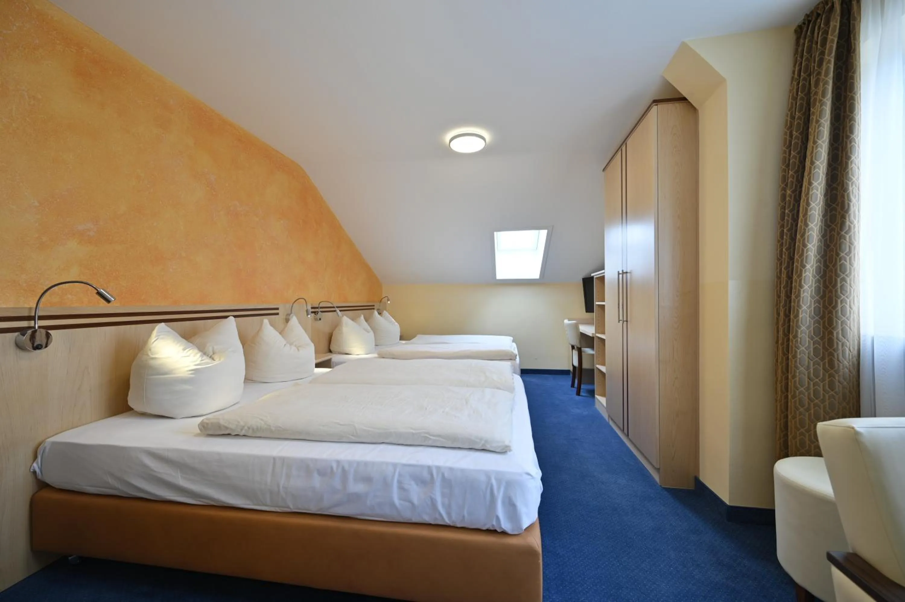 Bed in Hotel Apollo Garni