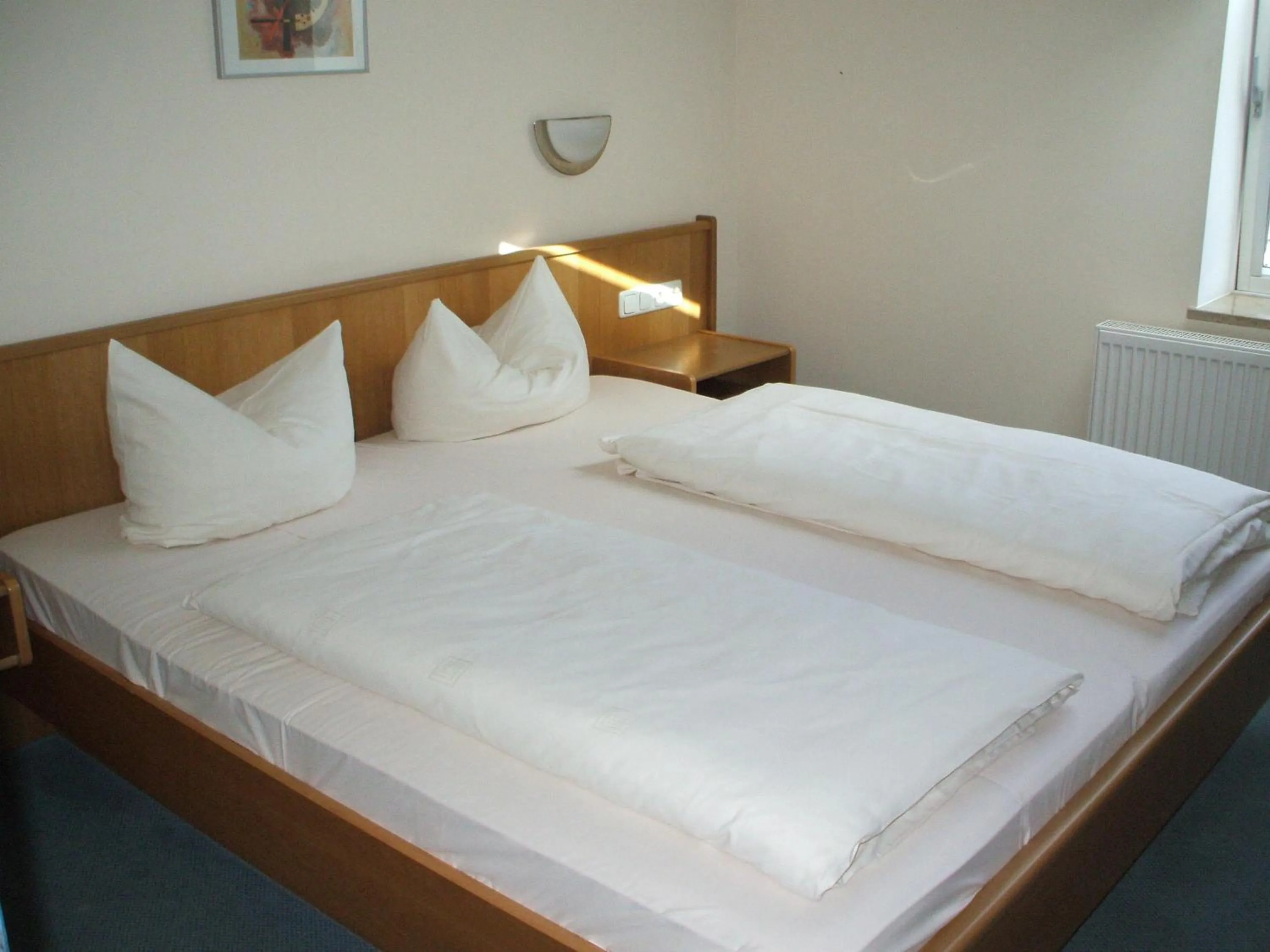 Bed in Hotel Apollo Garni