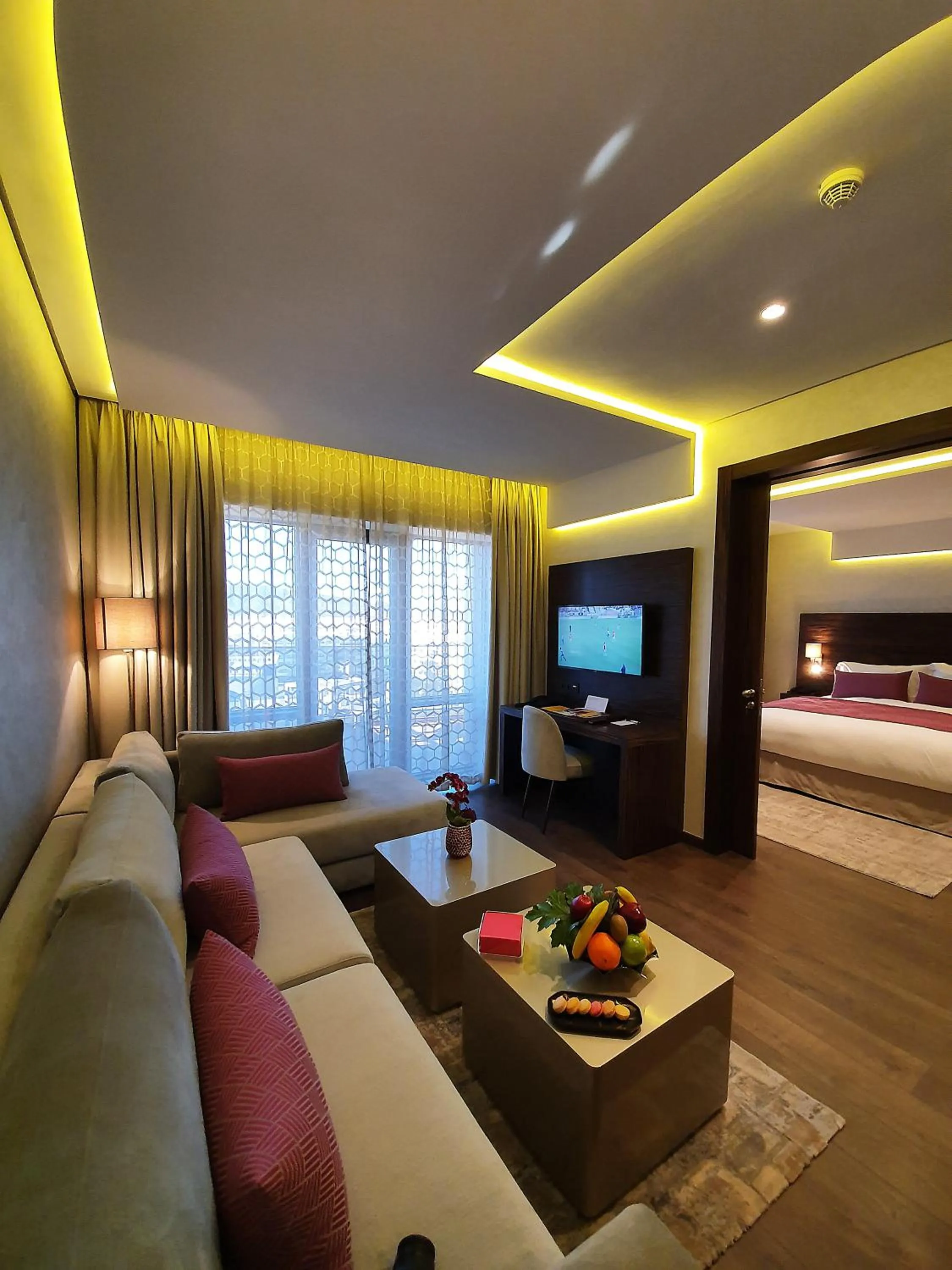 Seating area, Bed in Nour Plazza Hotel