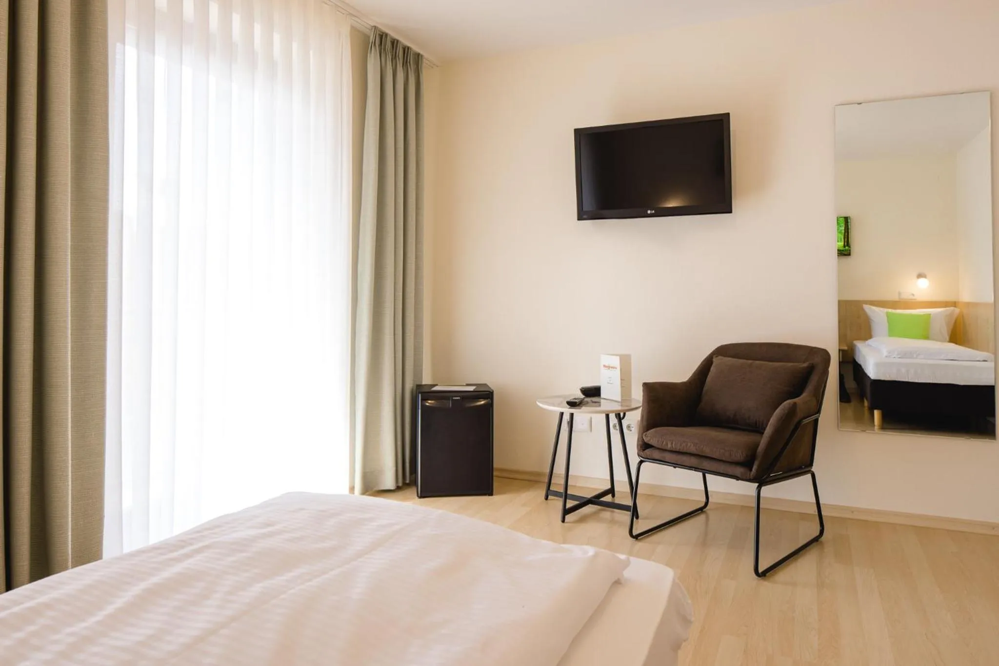 Photo of the whole room, Bed in AKZENT Hotel Meerfräulein