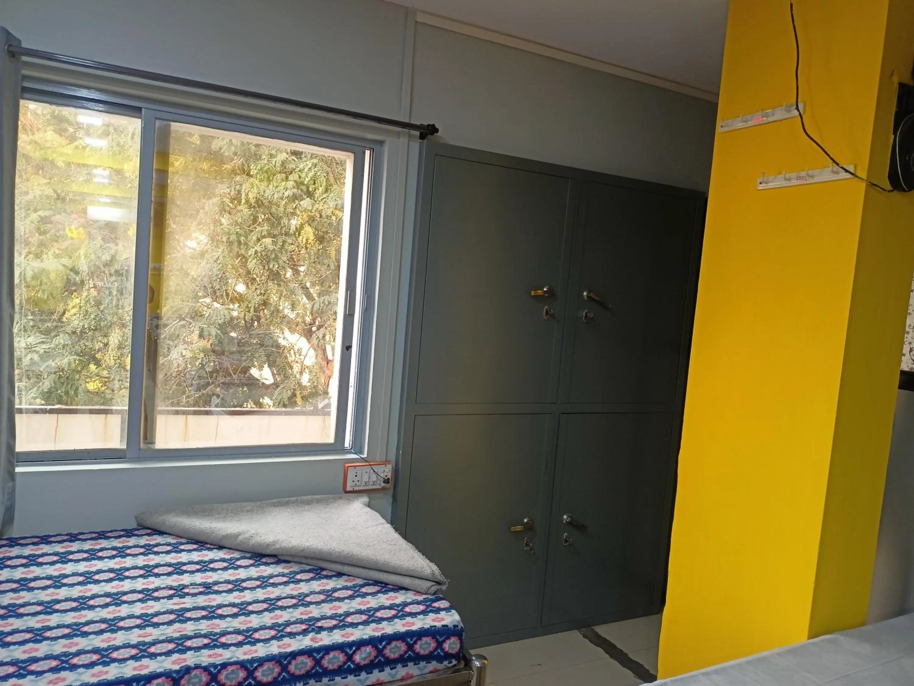 Bed in Shiv Sai Dormitory