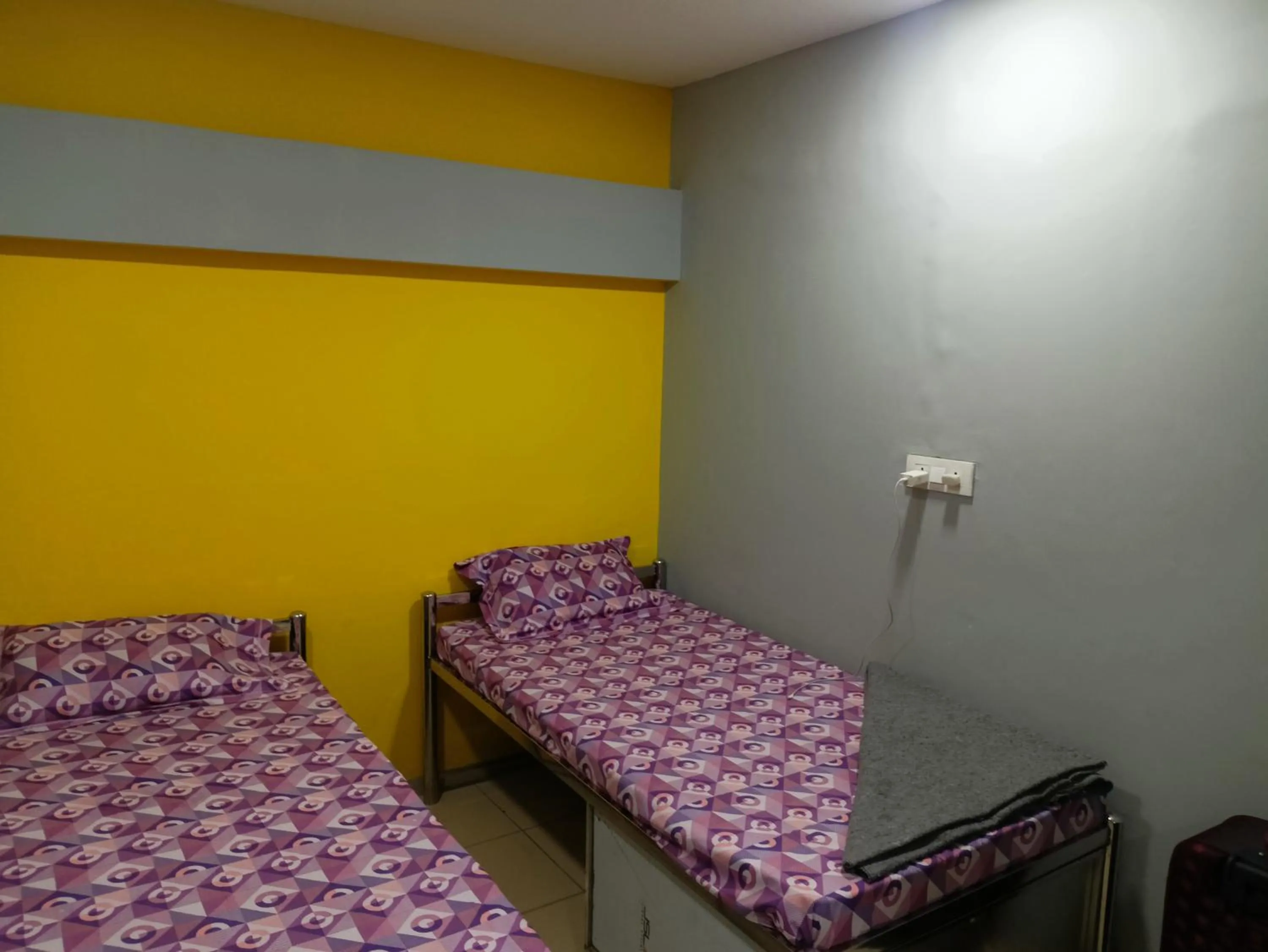 Bed in Shiv Sai Dormitory