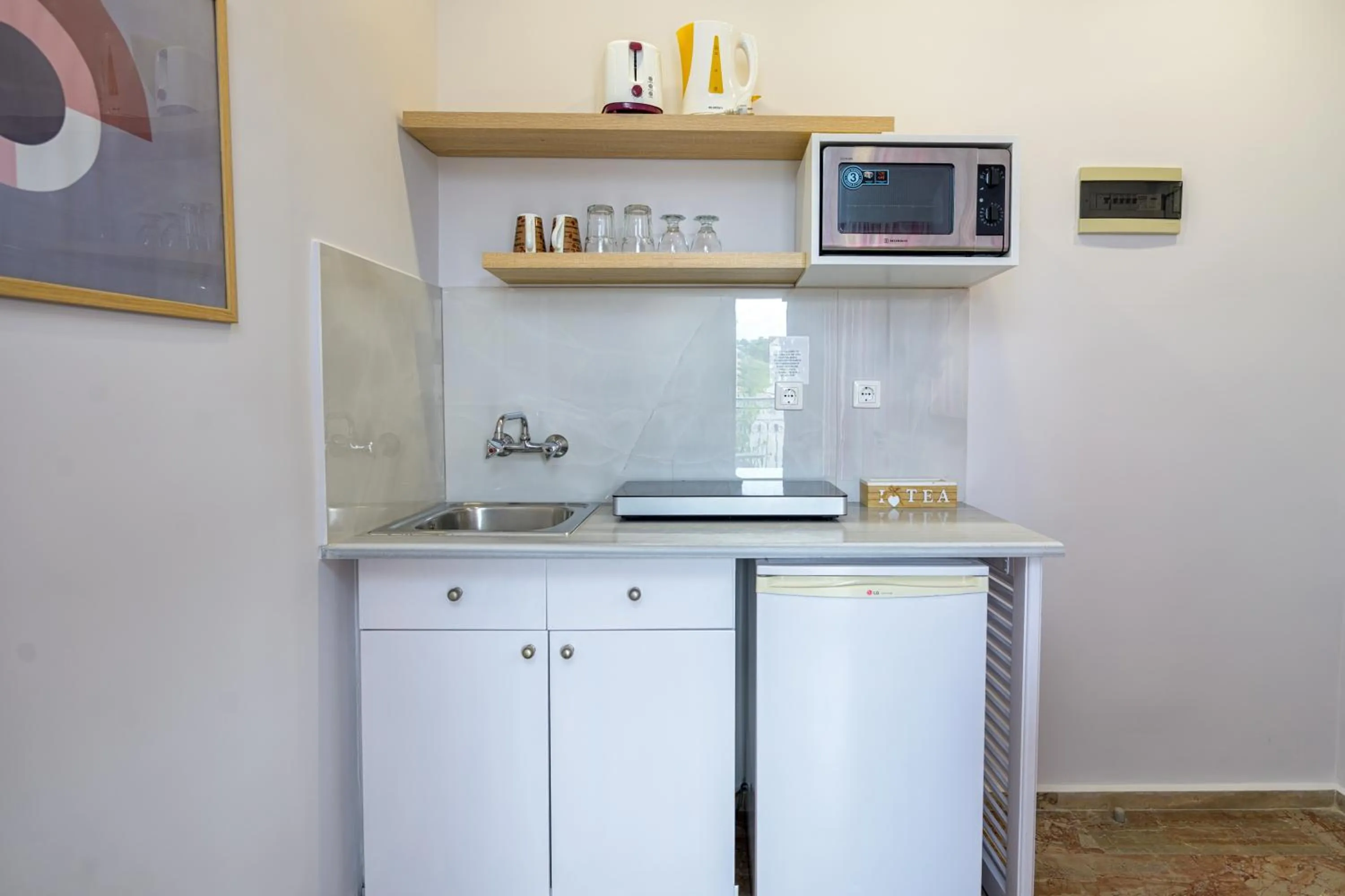 Kitchen or kitchenette in KORINA APART HOTEL KAVOS