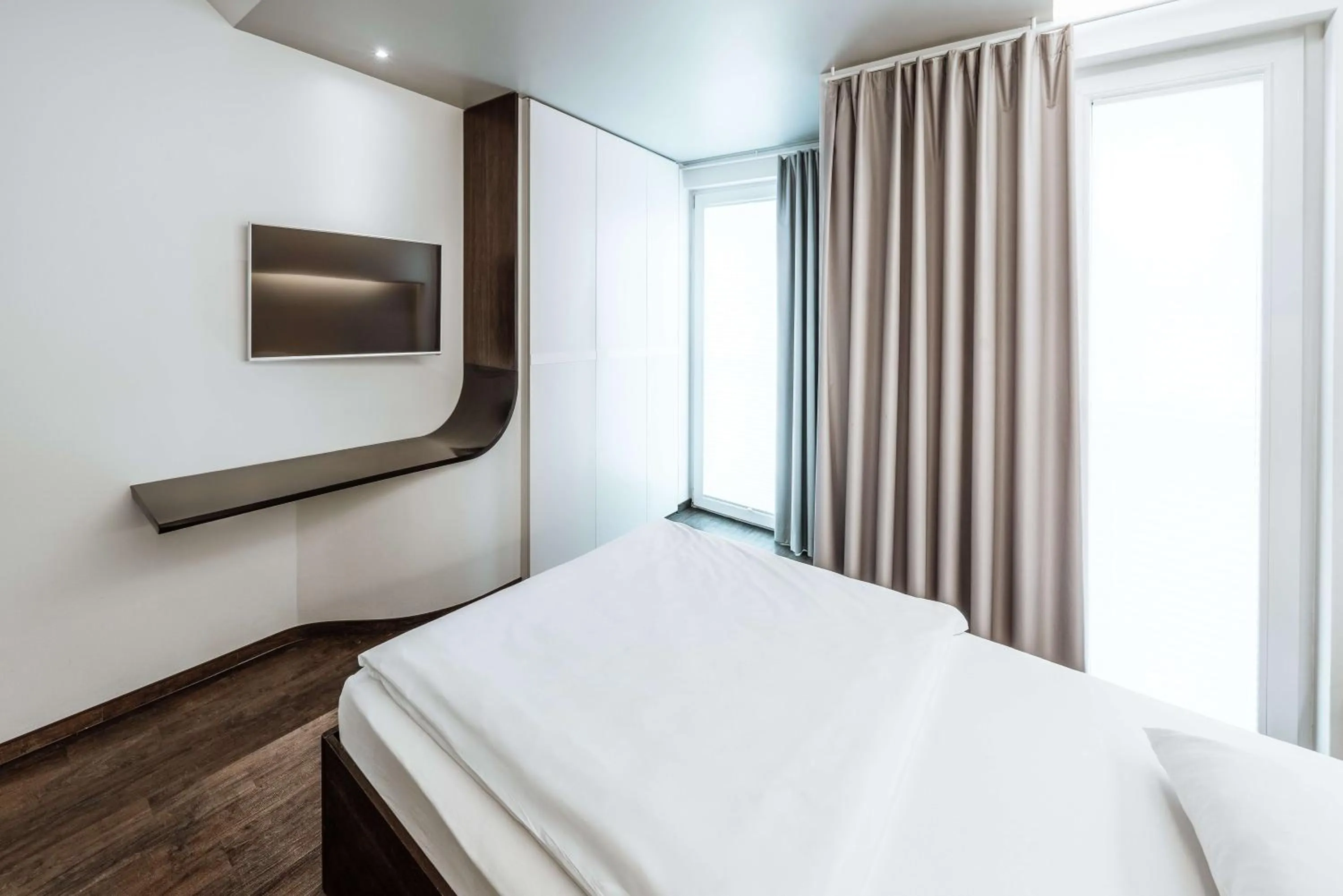 Living room, Bed in Hotel Q! Berlin