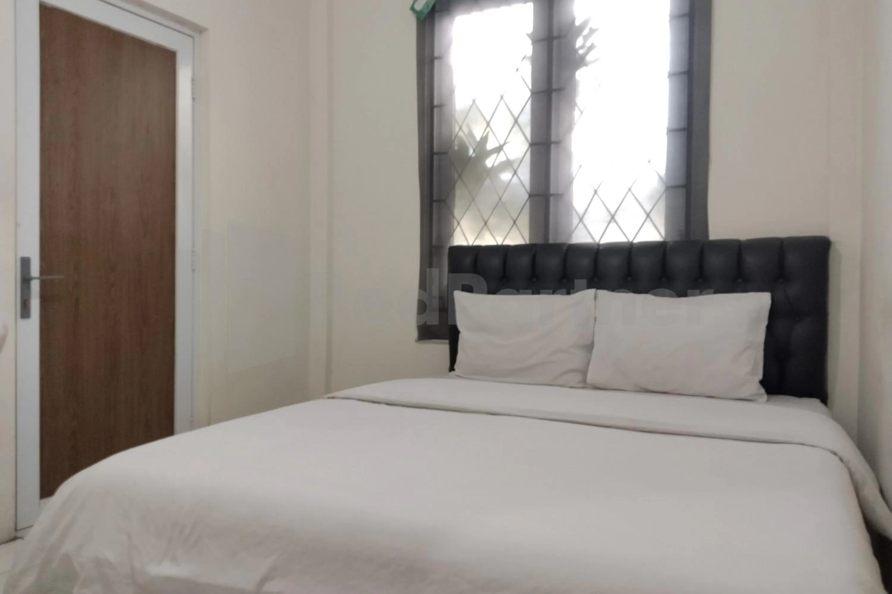 Bedroom in House Of Mahira Syariah Mitra RedDoorz