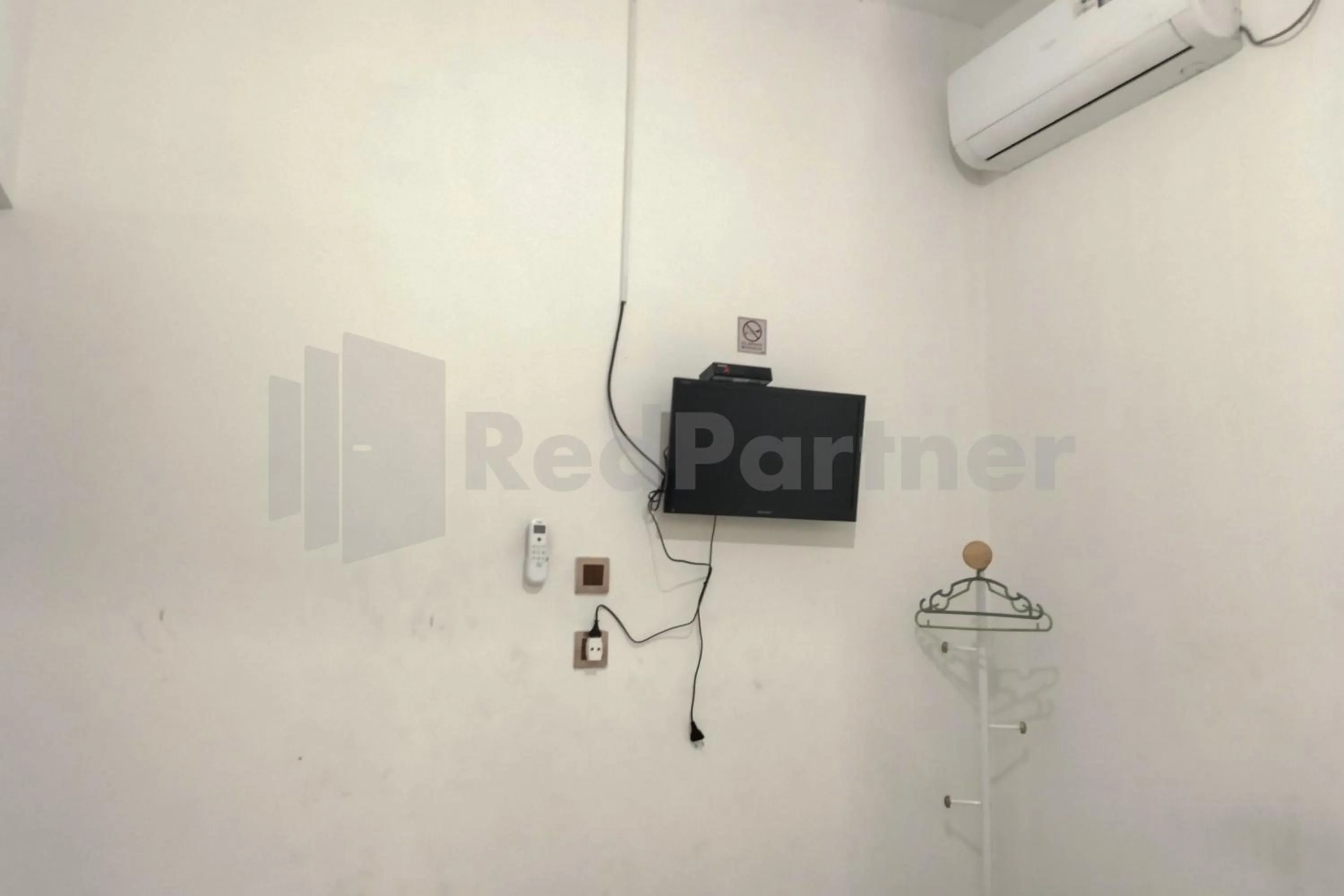 Bedroom in House Of Mahira Syariah Mitra RedDoorz