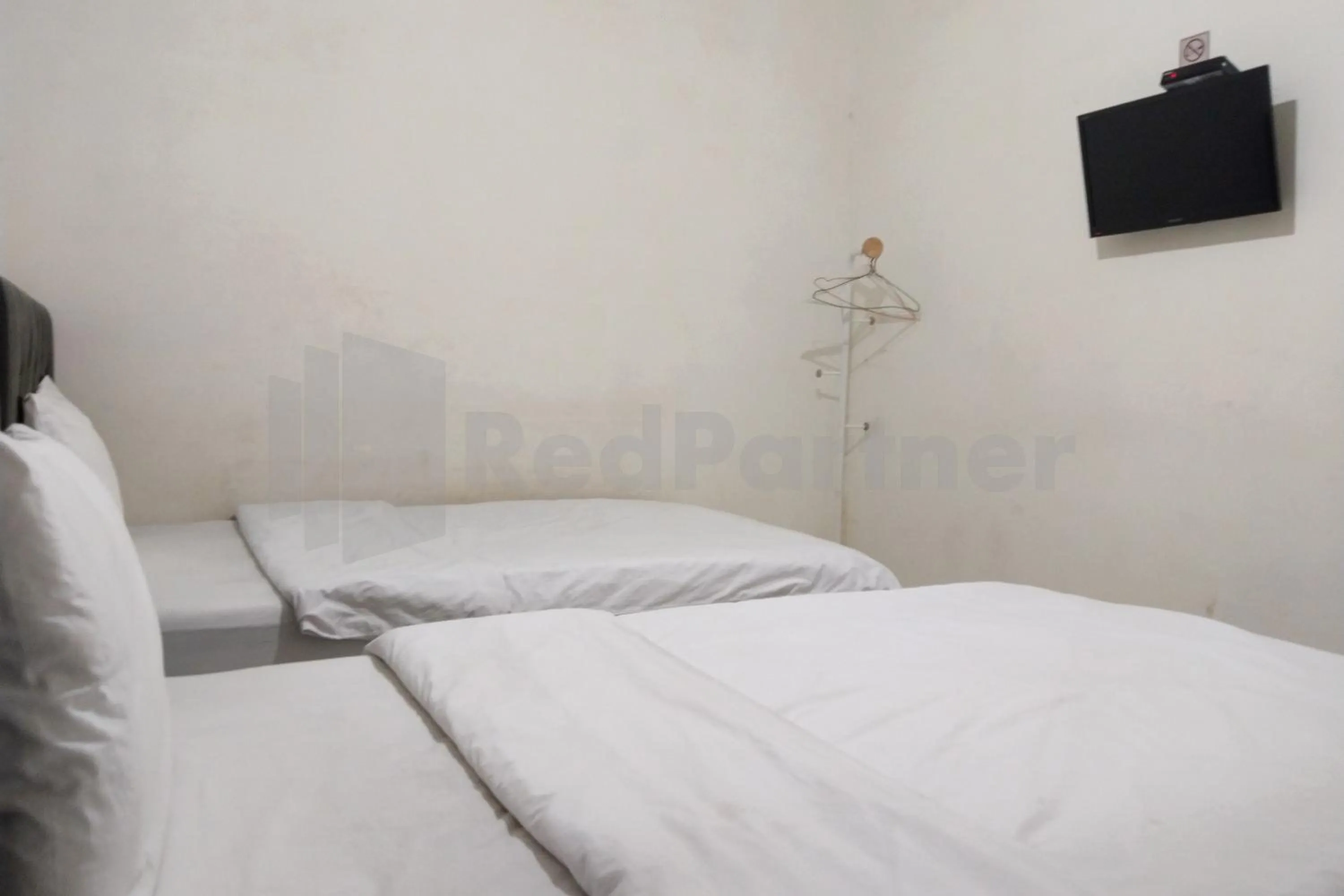 Bedroom in House Of Mahira Syariah Mitra RedDoorz