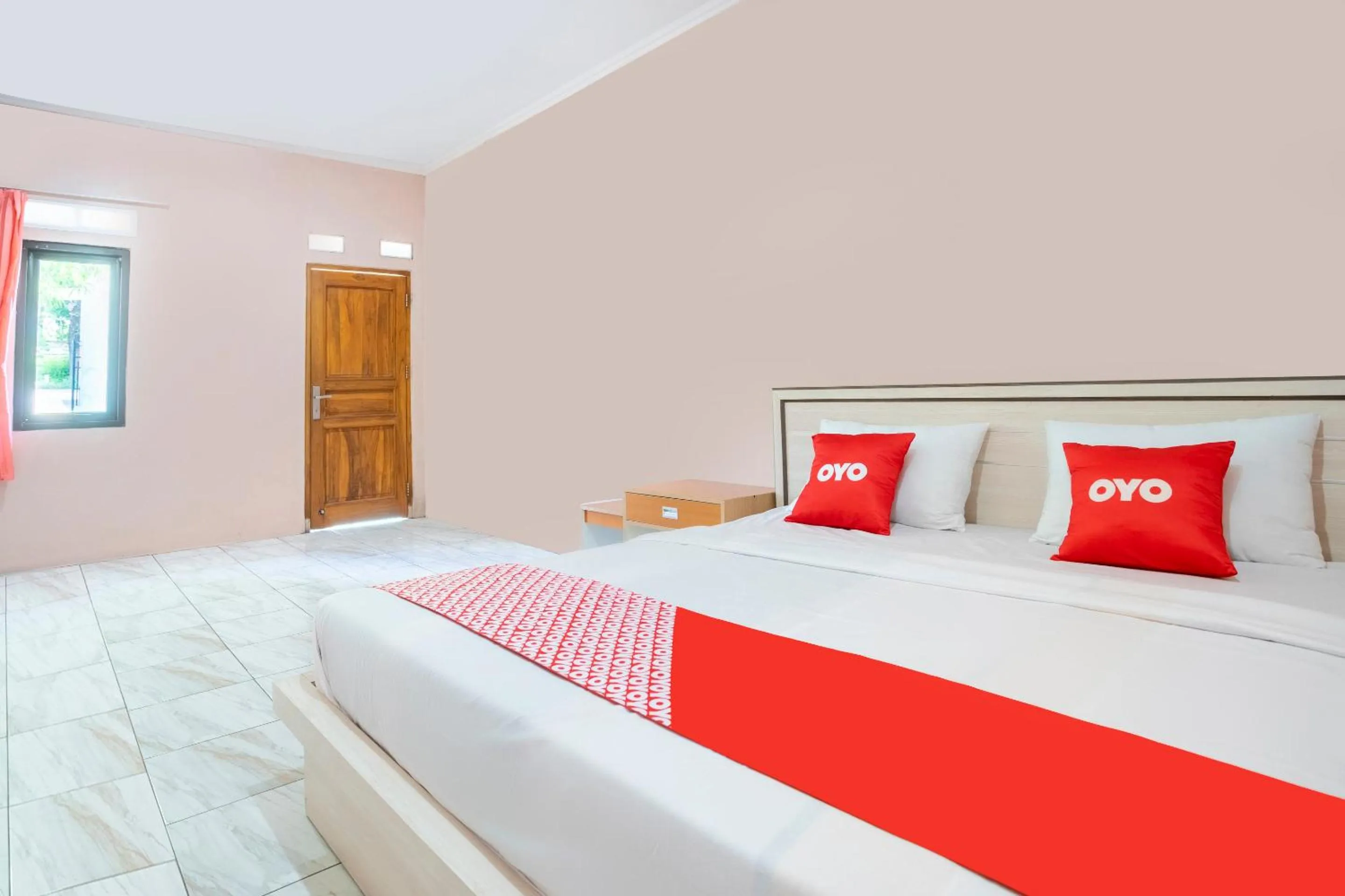 Bedroom in SPOT ON 2974 Penginapan Roma 88