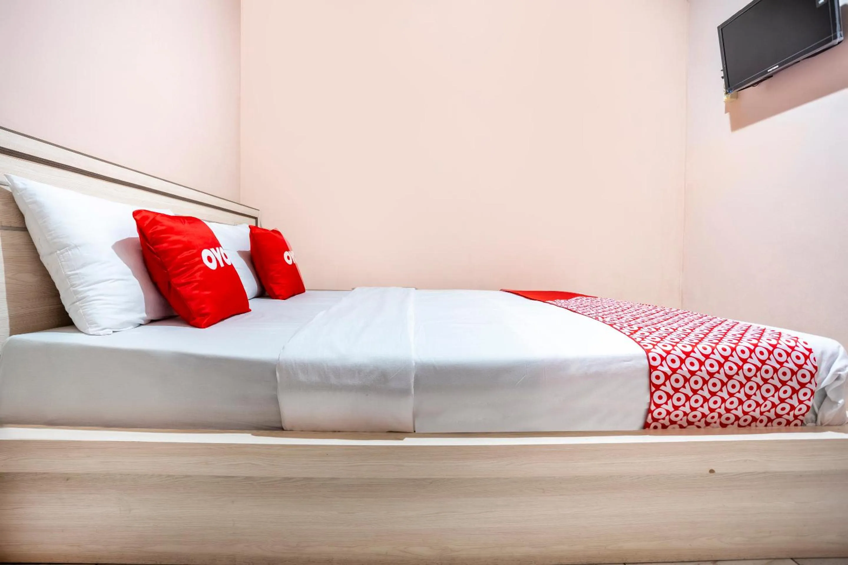 Bedroom in SPOT ON 2974 Penginapan Roma 88