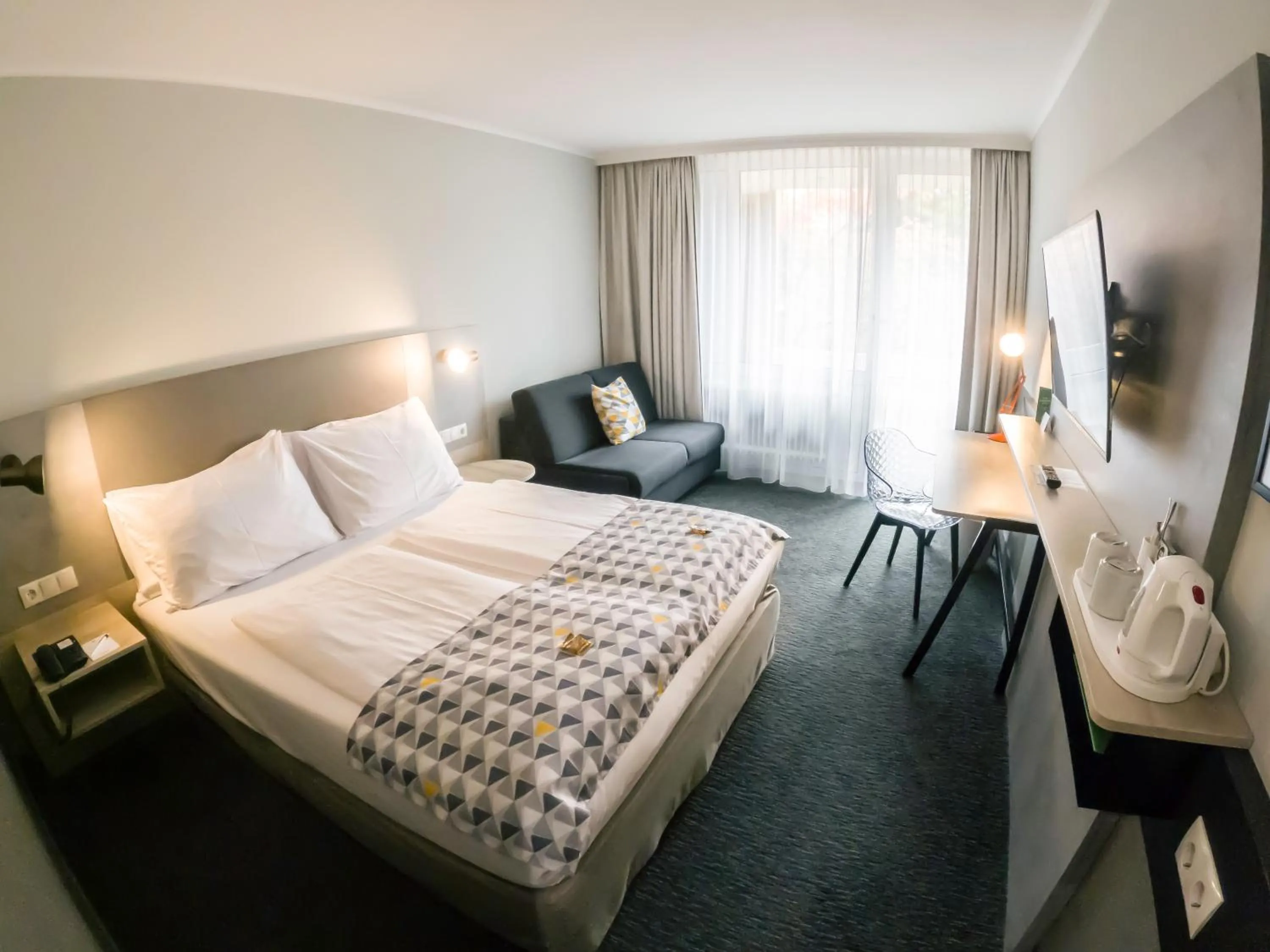 Photo of the whole room, Bed in Holiday Inn Munich - South by IHG