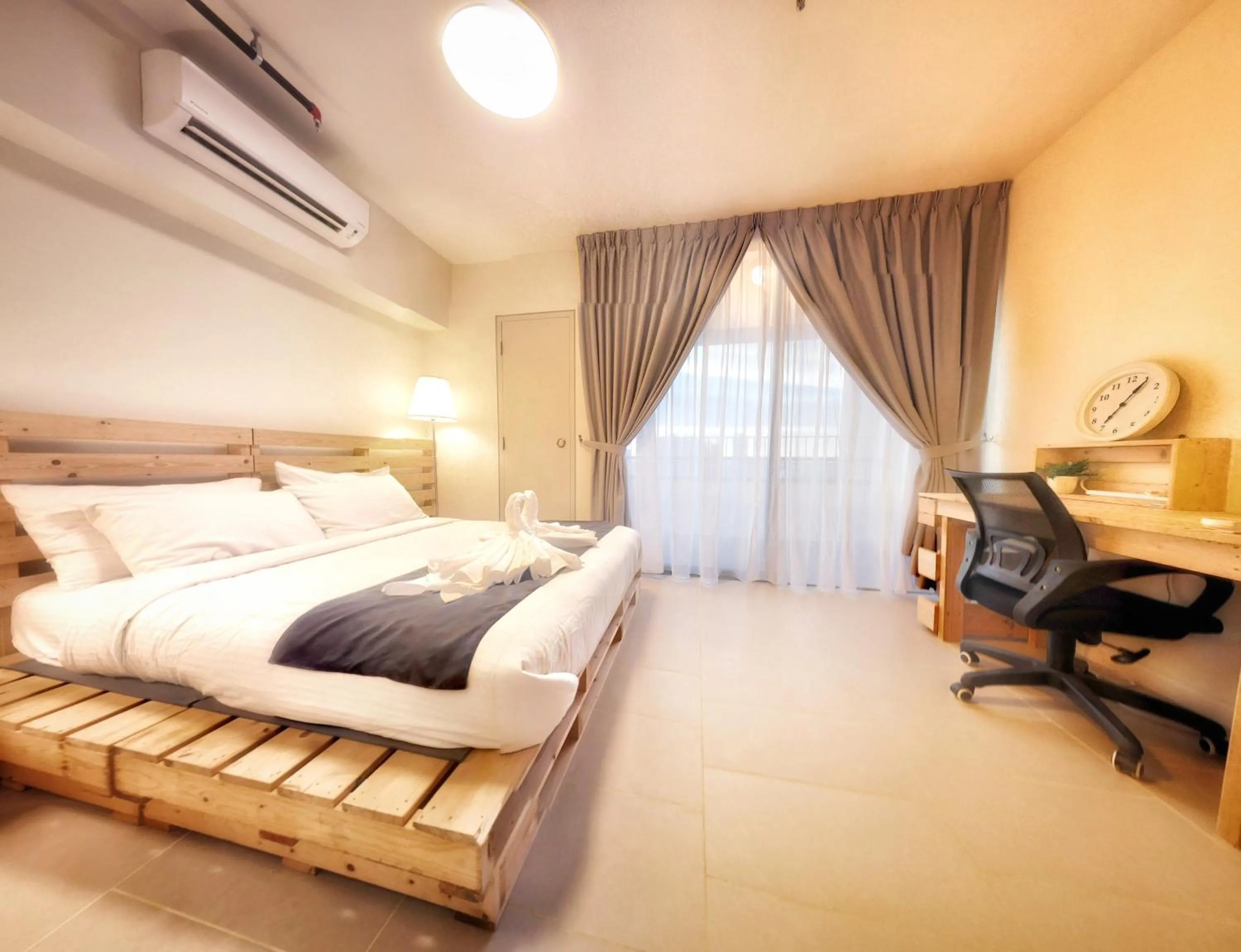 Bed in Tamarind Suites by BeeStay Management