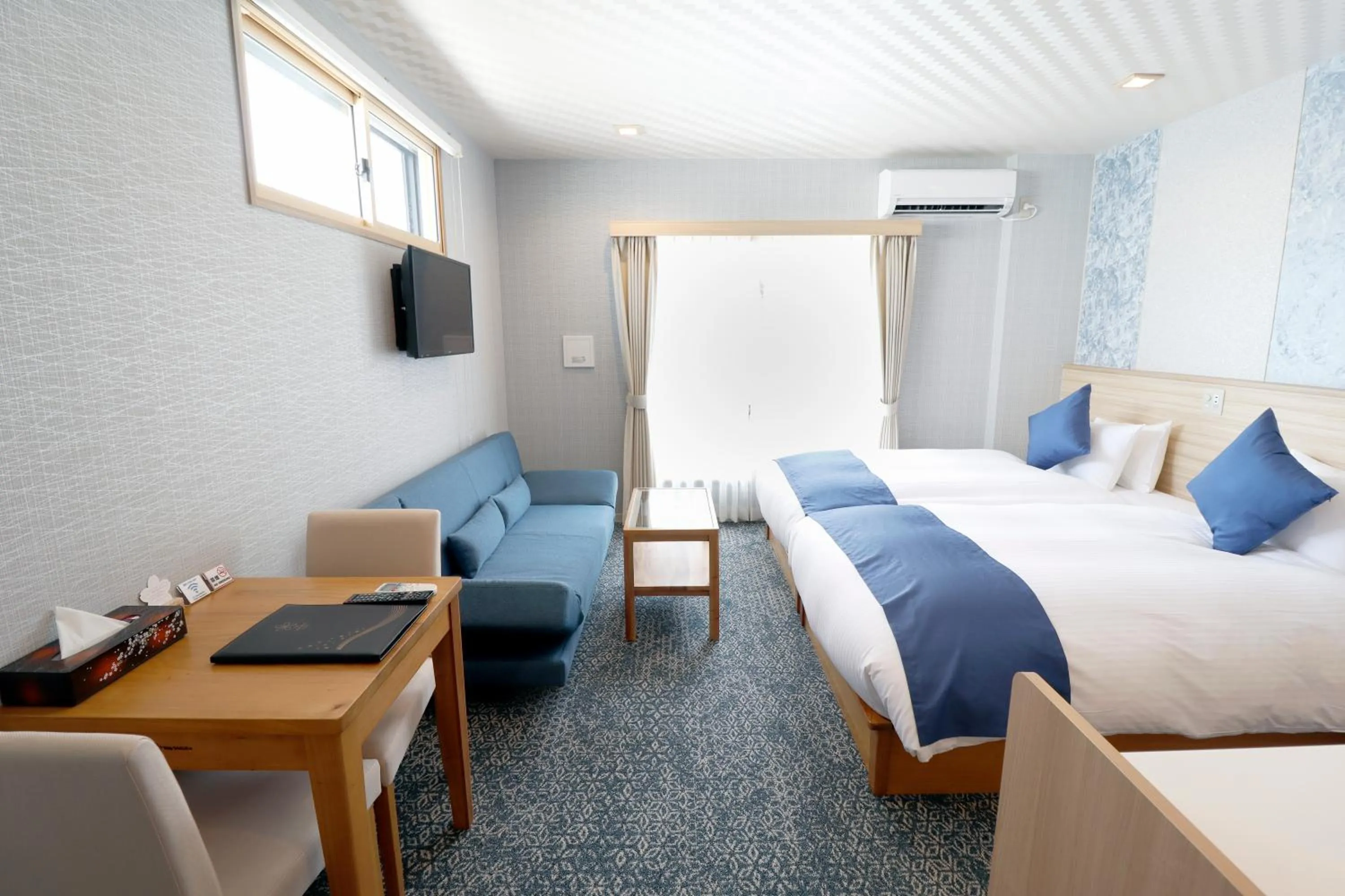 Living room, Bed in Stay SAKURA Kyoto Tambaguchi