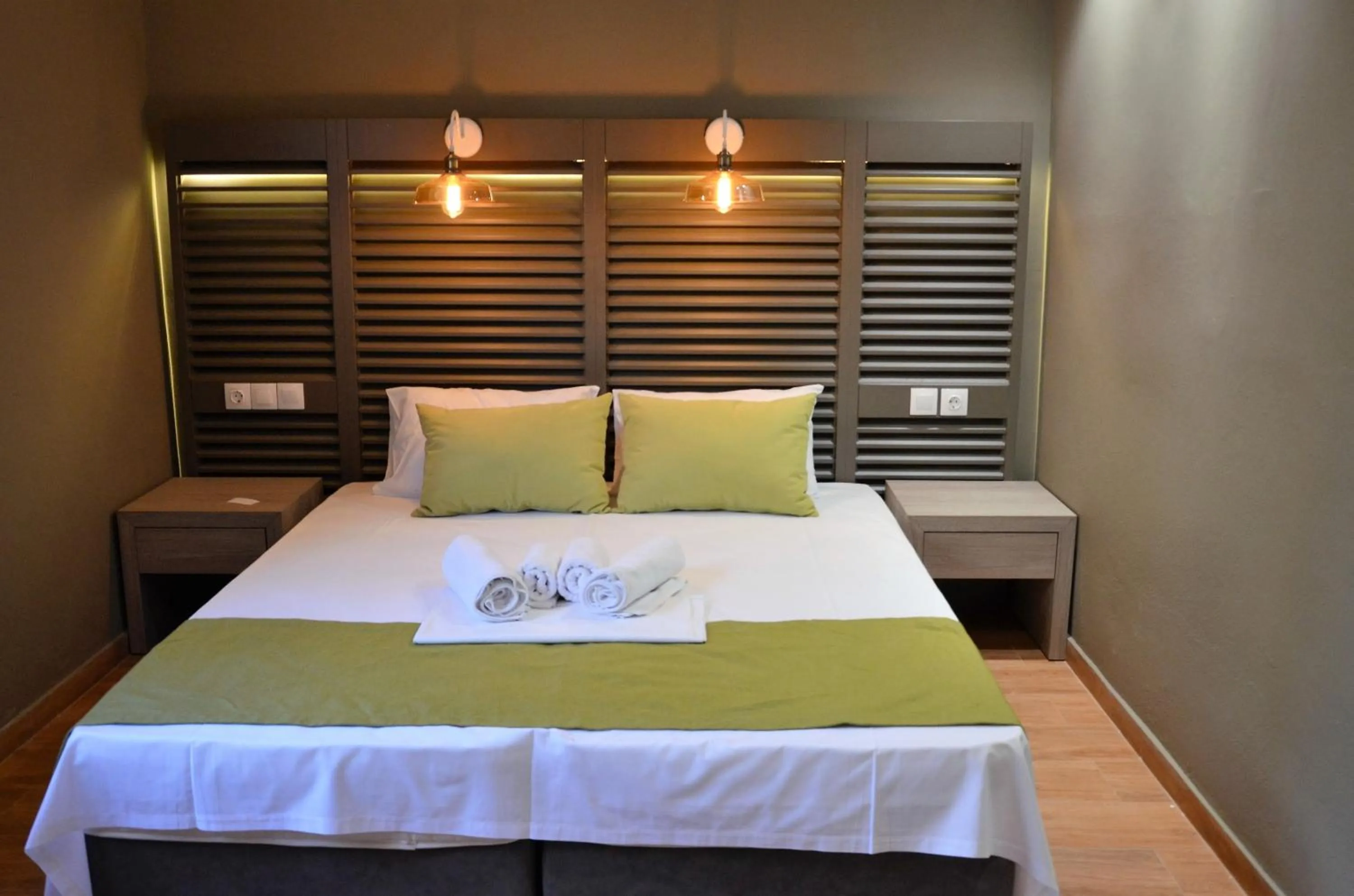 Bed in Ampoulos Rooms & Apartments