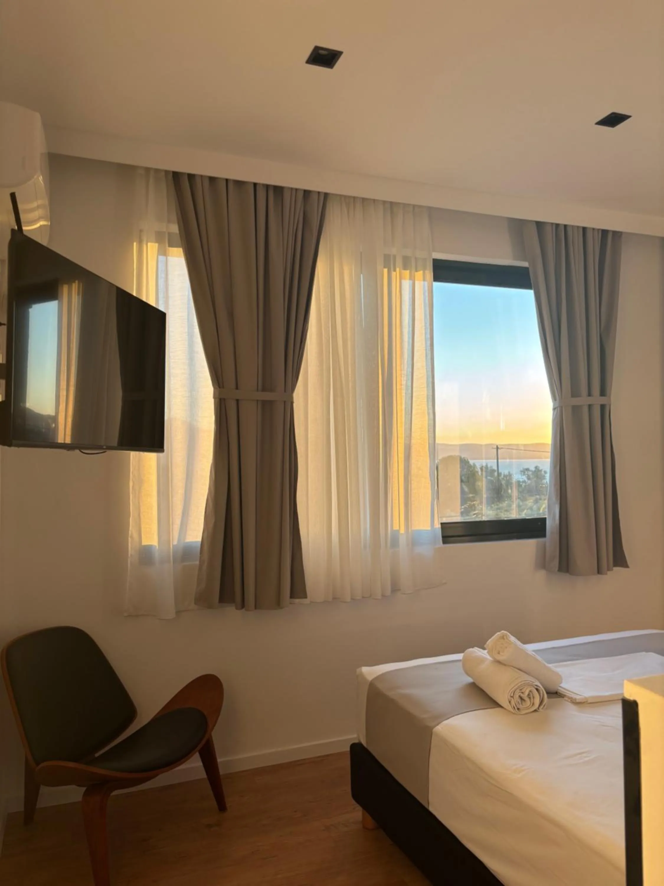 Bed in Ampoulos Rooms & Apartments