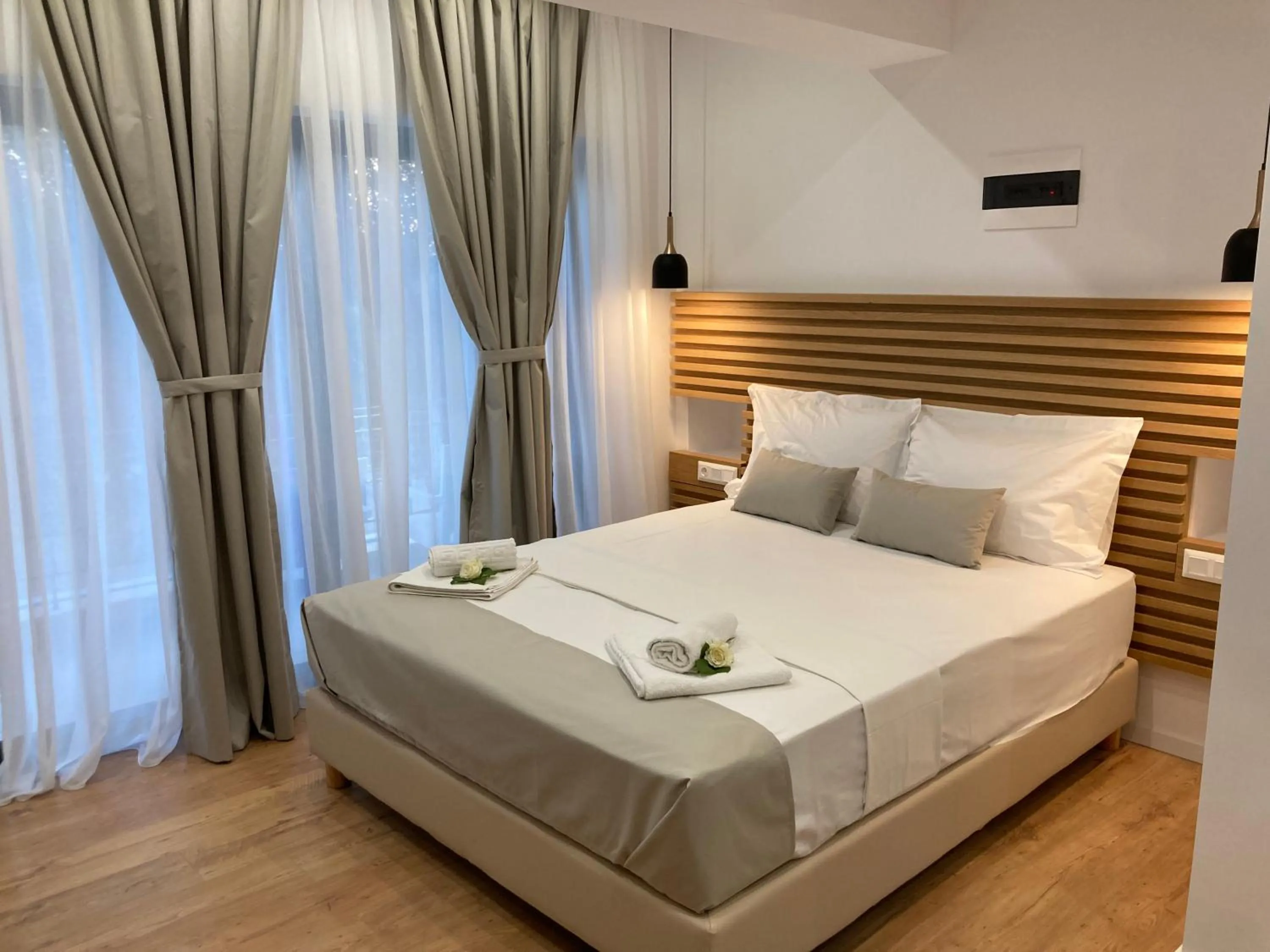 Bed in Ampoulos Rooms & Apartments