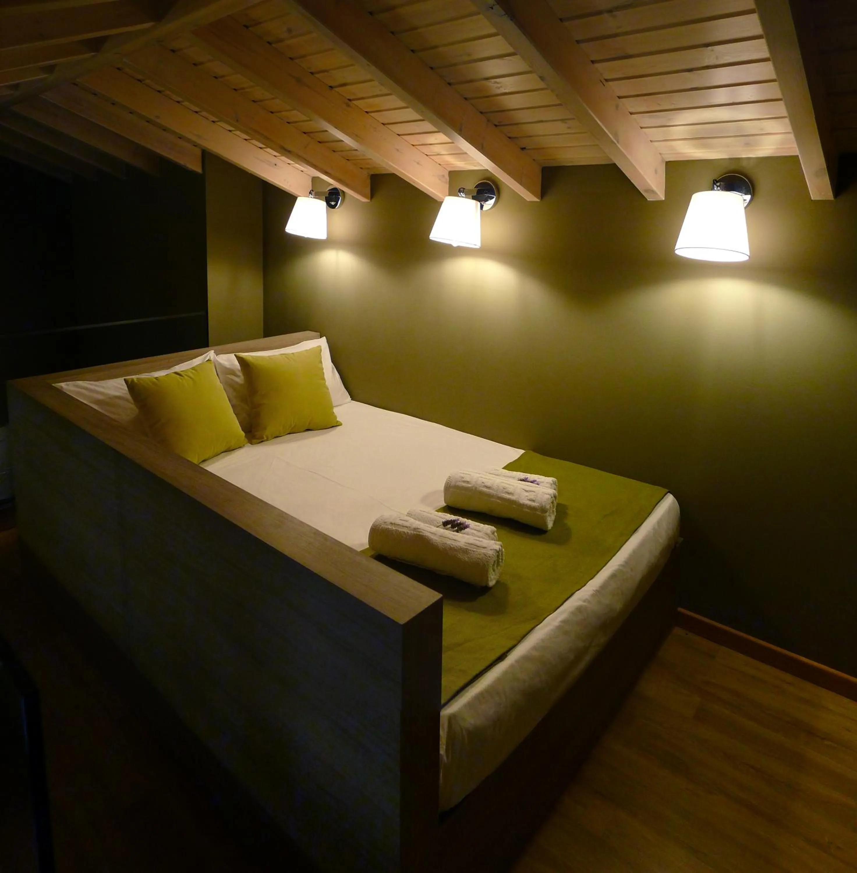 Bed in Ampoulos Rooms & Apartments