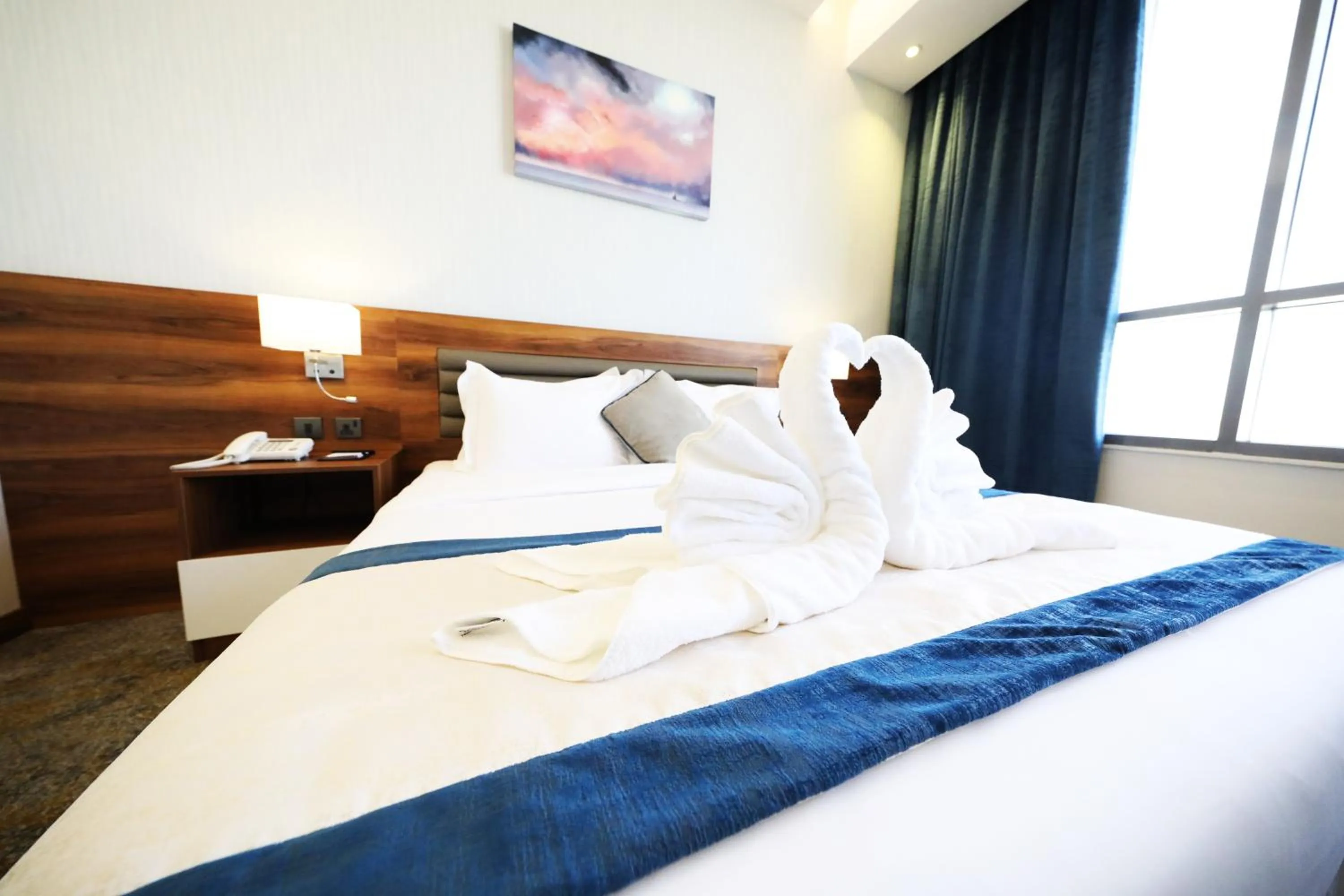 towels, Bed in Eva Hotel