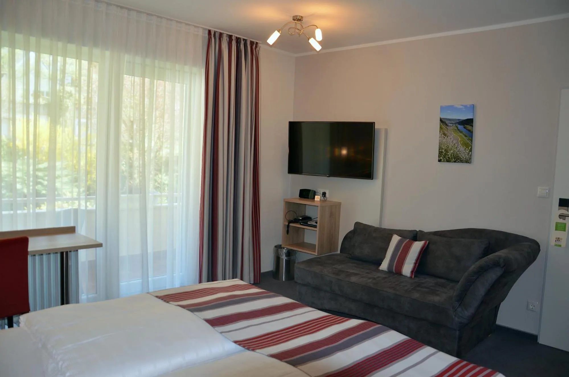 Seating area, Bed in Flair Hotel am Rosenhügel - Garni