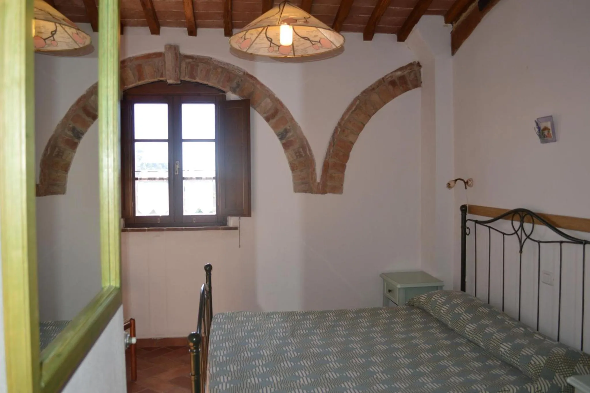 Bedroom in Holidays in apartment with swimming pool in Tuscany Siena