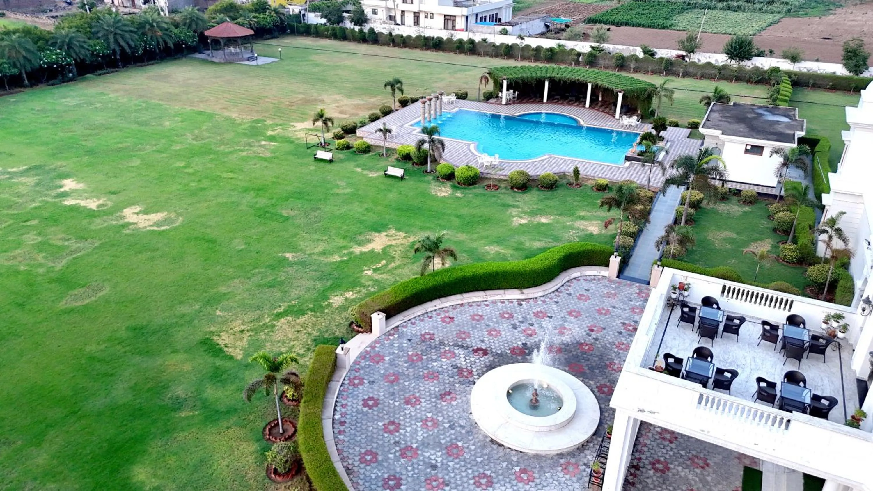Swimming pool in Umaid Farm Resort- A Legancy Vintage Stay In Jaipur