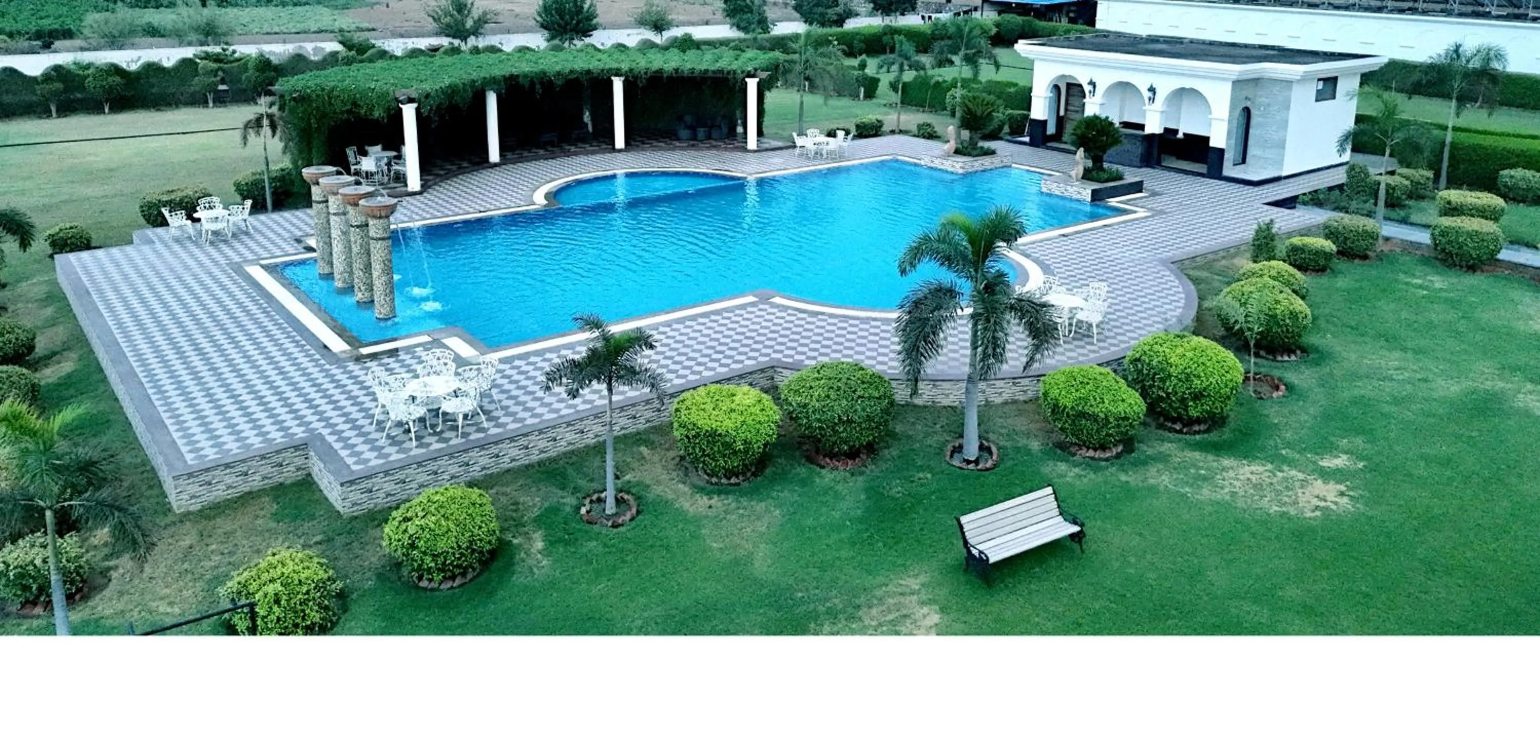 Swimming pool in Umaid Farm Resort- A Legancy Vintage Stay In Jaipur