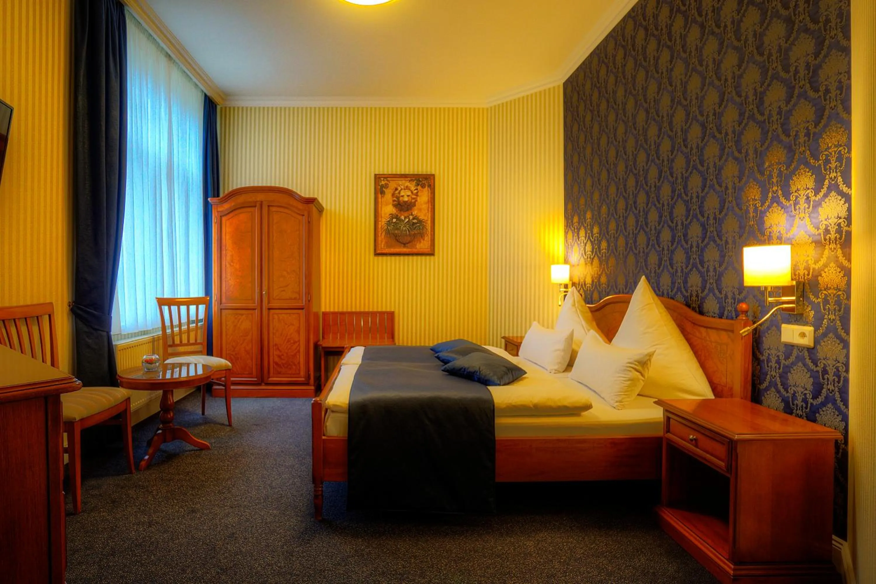 Photo of the whole room, Bed in KurparkHotel Warnemünde