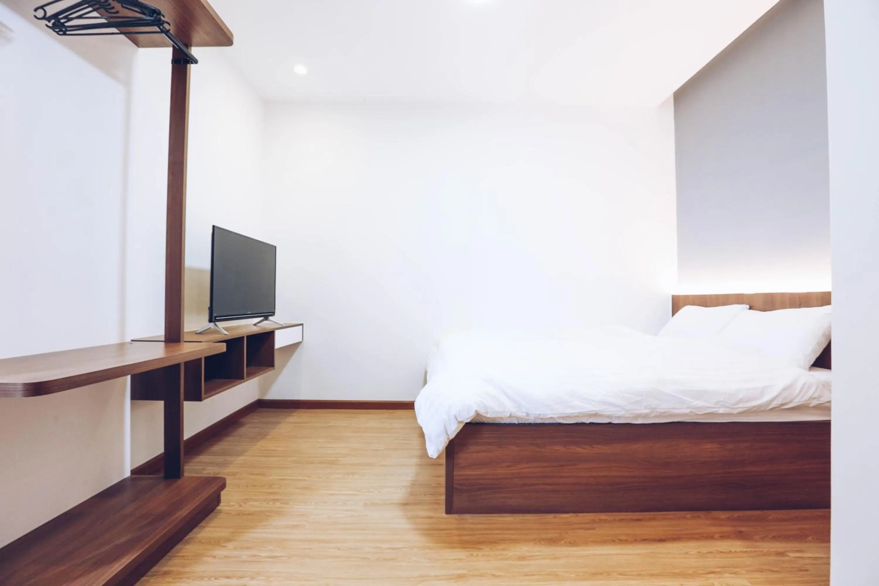 Bed in TTR Studio Apart Hotel