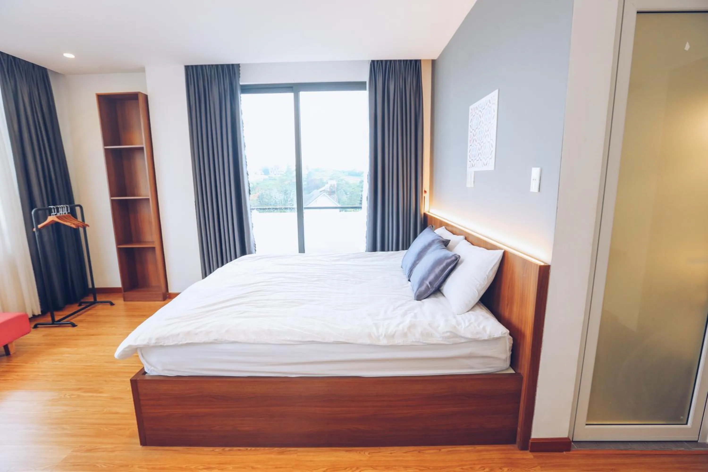 Bed in TTR Studio Apart Hotel