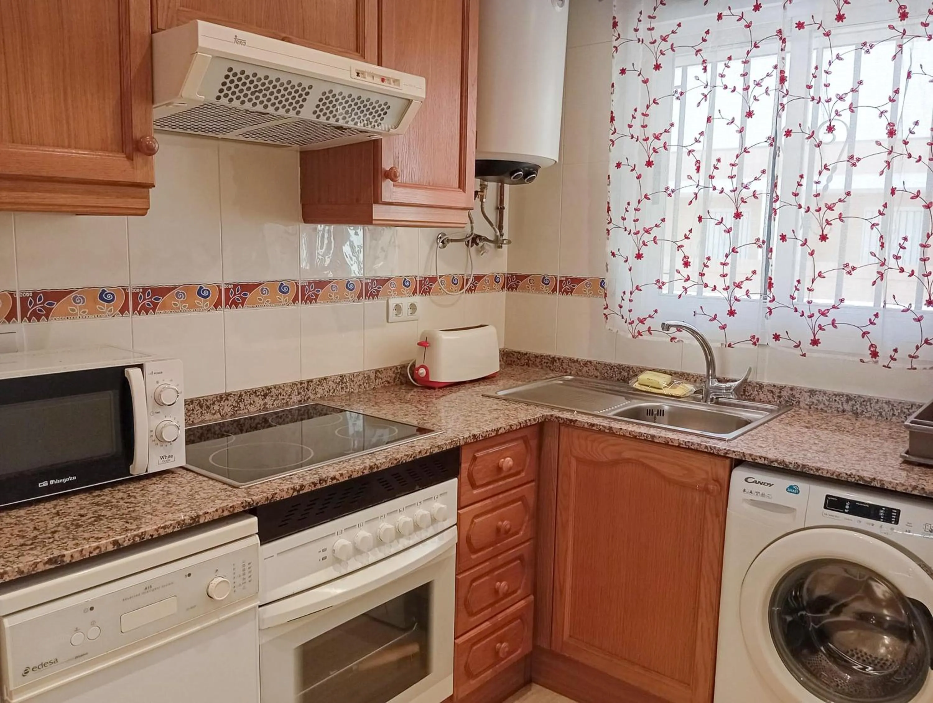 Communal kitchen in Apartamentos Caribe Marina D’Or 3000