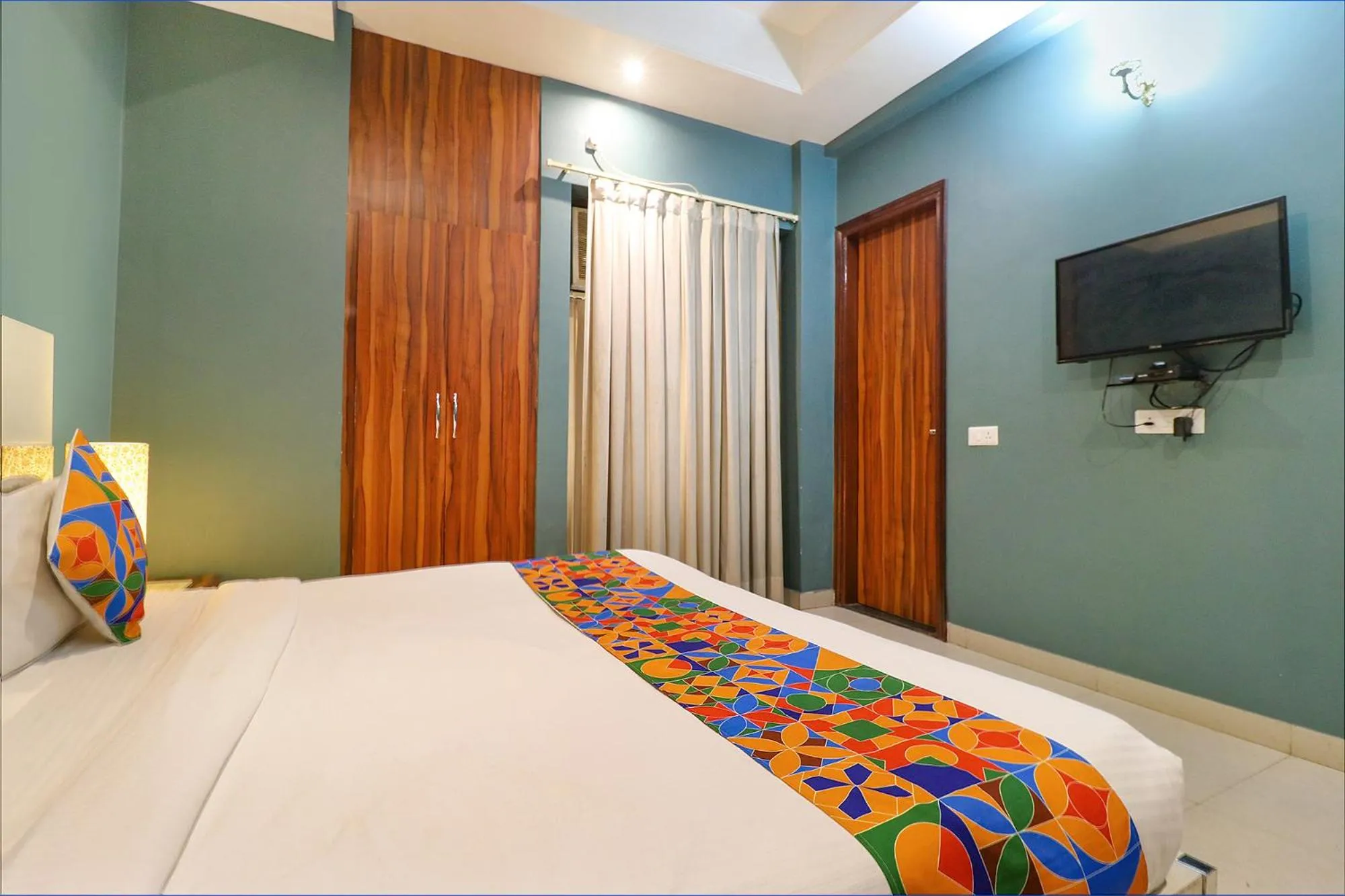 Bed in FabHotel Maxx Inn