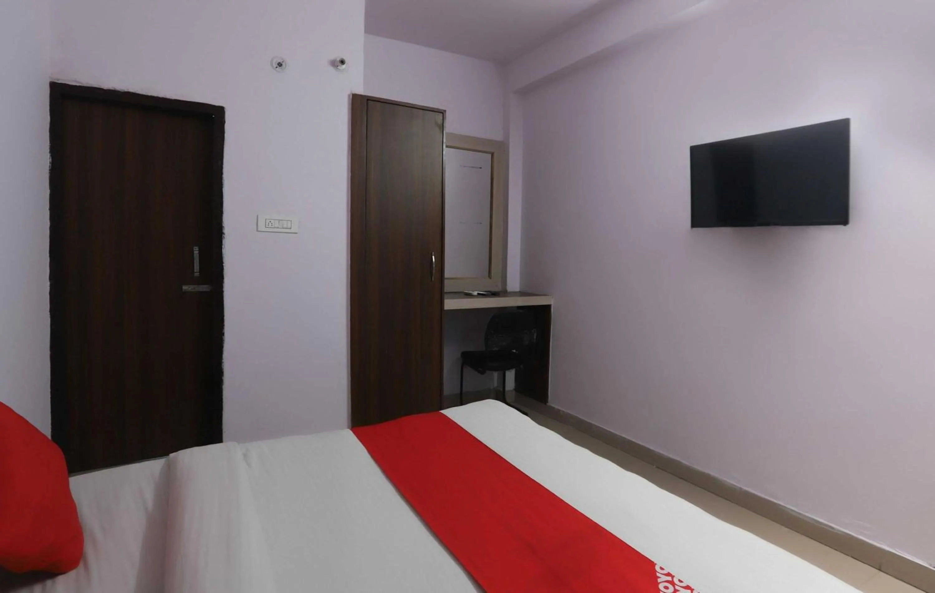Bedroom in Hotel O Noida Villa