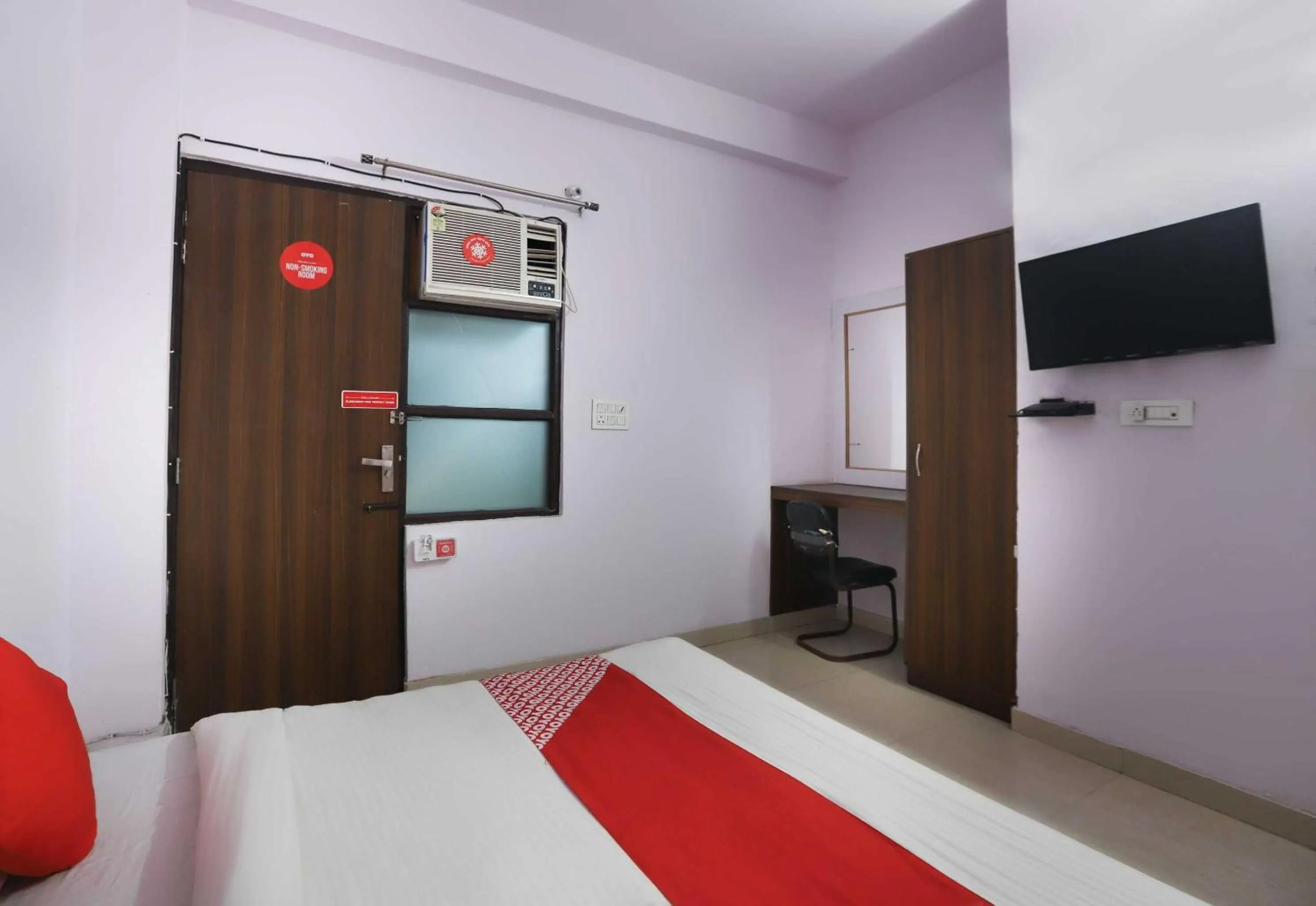 Bedroom in Hotel O Noida Villa