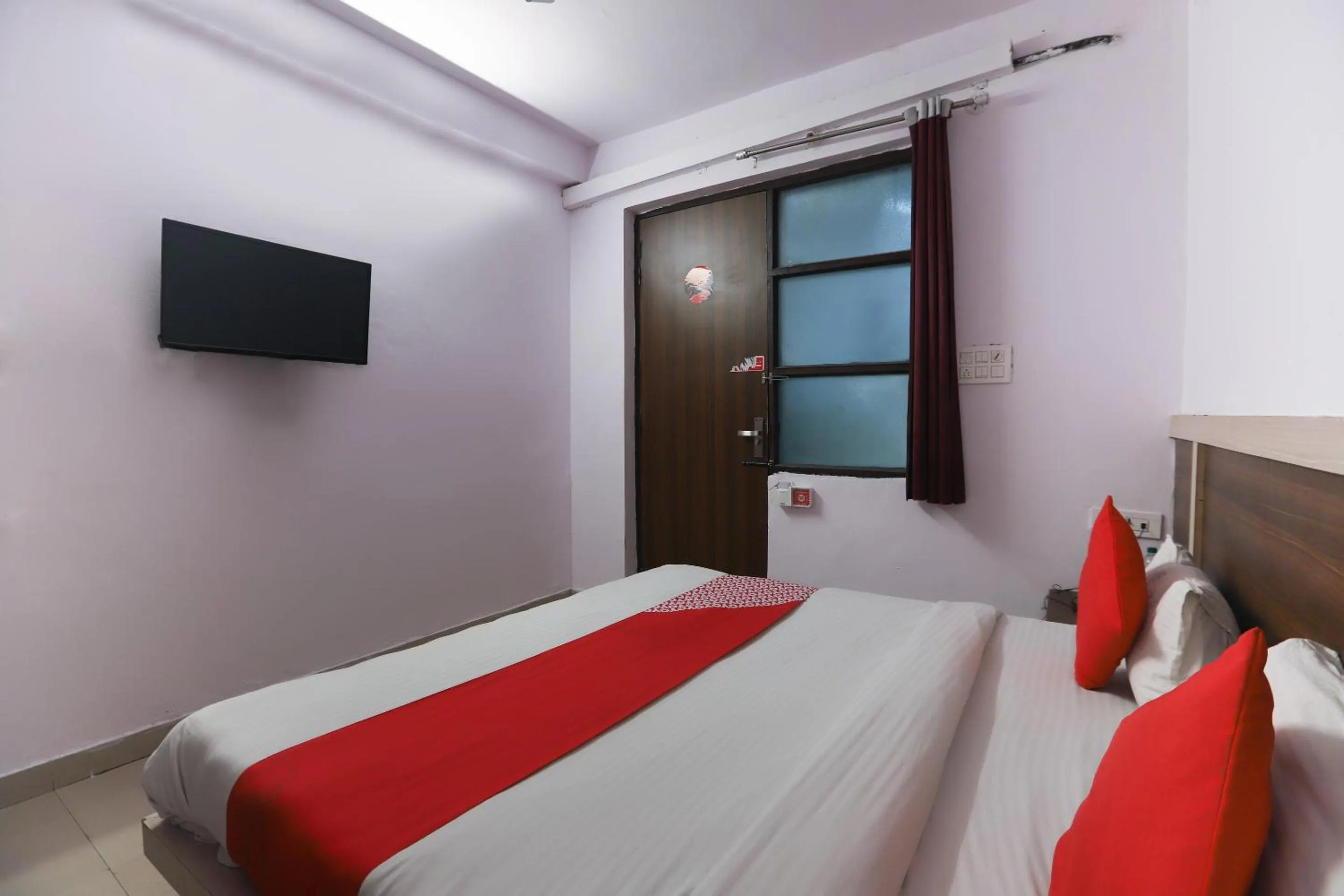Bedroom in Hotel O Noida Villa