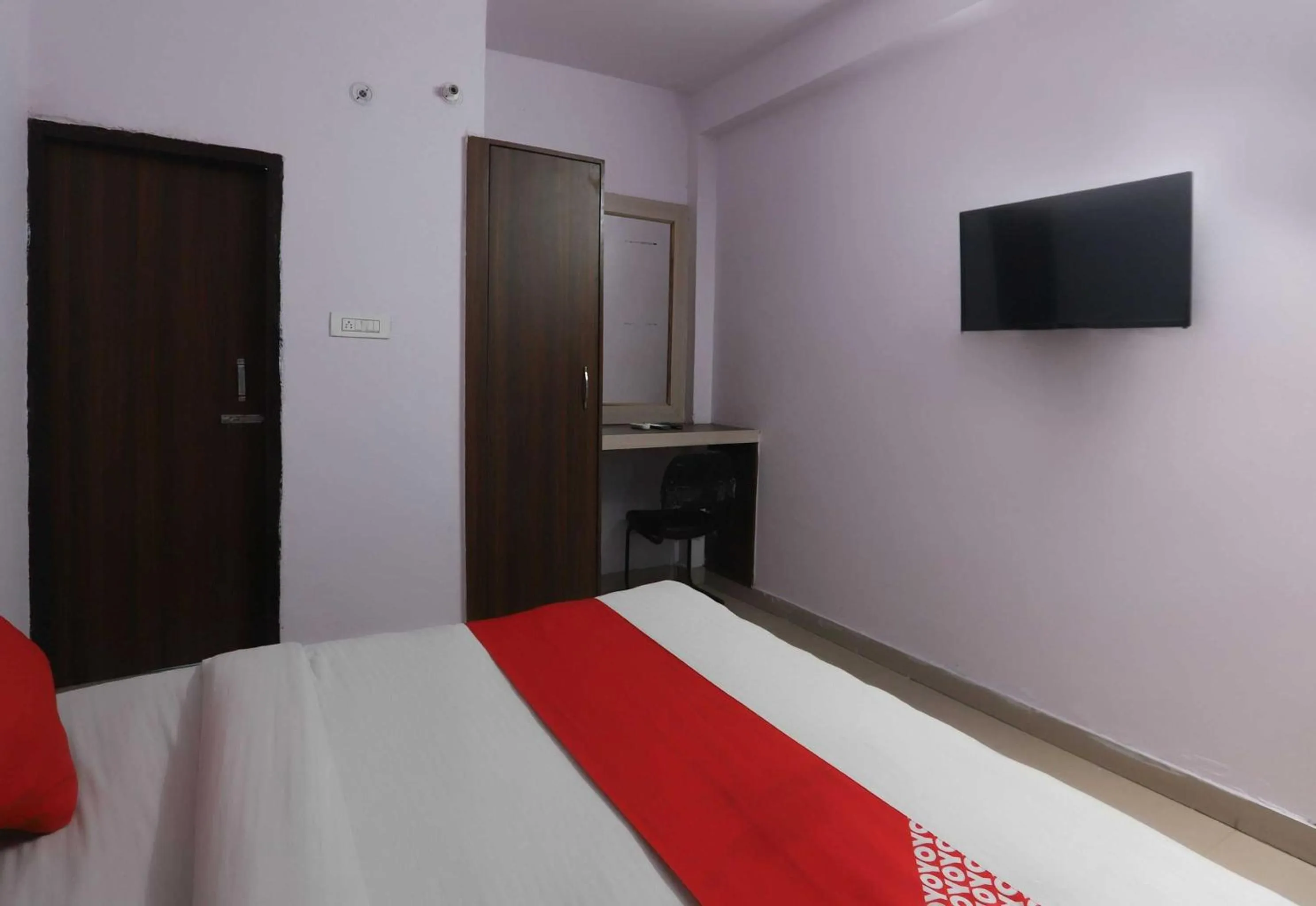 Bedroom in Hotel O Noida Villa