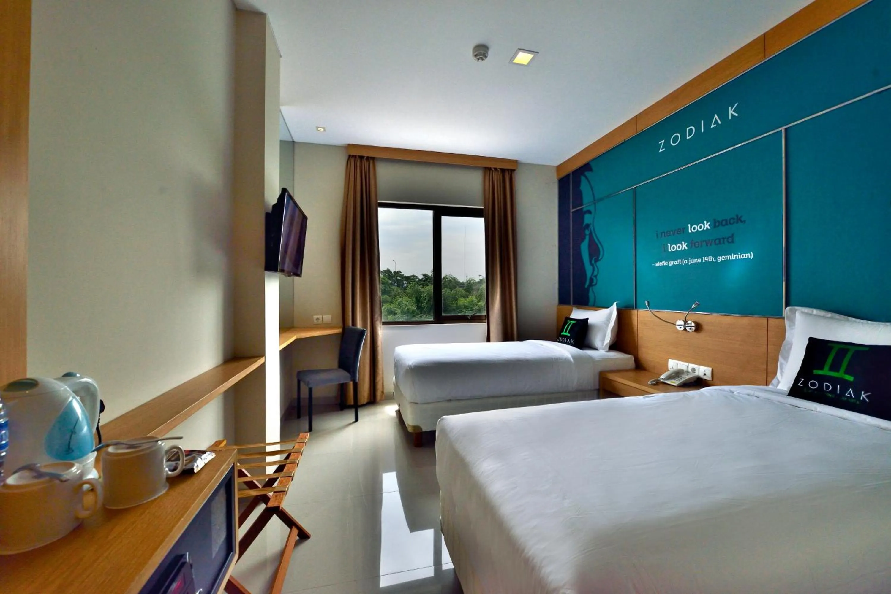Photo of the whole room, Bed in Zodiak MT Haryono by KAGUM Hotels