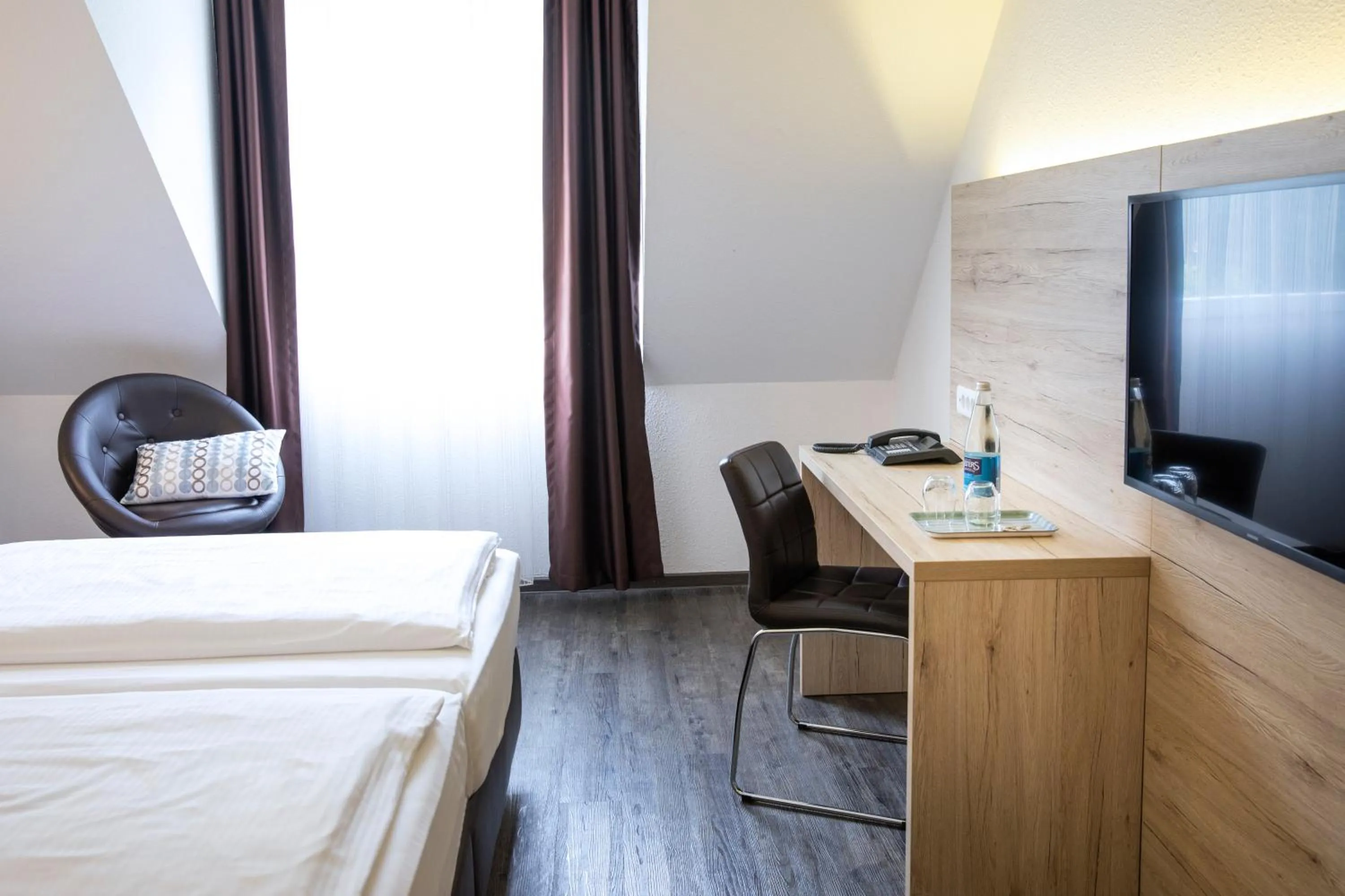 Photo of the whole room, Bed in ACHAT Hotel Monschau