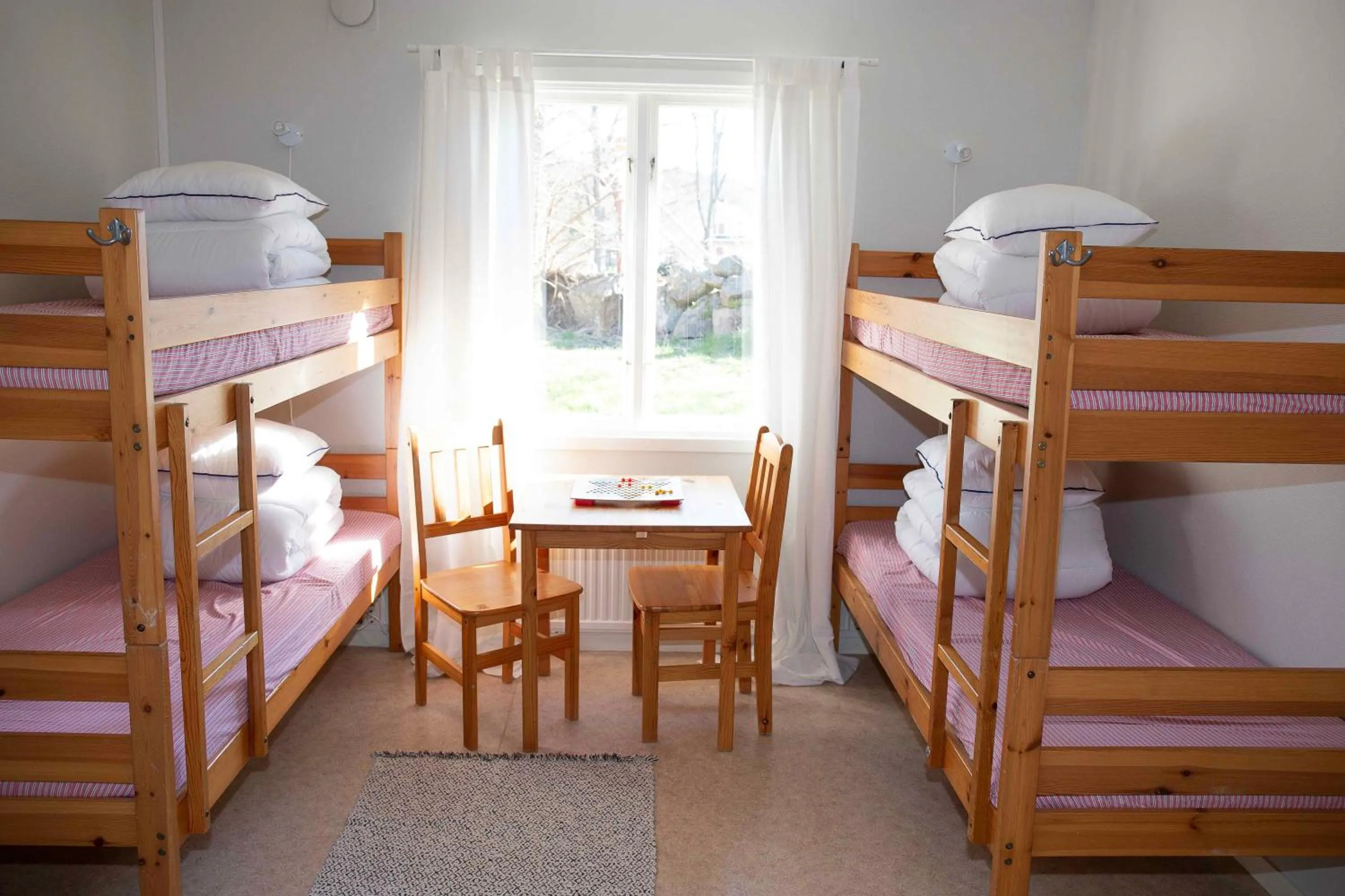 Seating area, Bed in Hunnebostrands vandrarhem Gammelgården