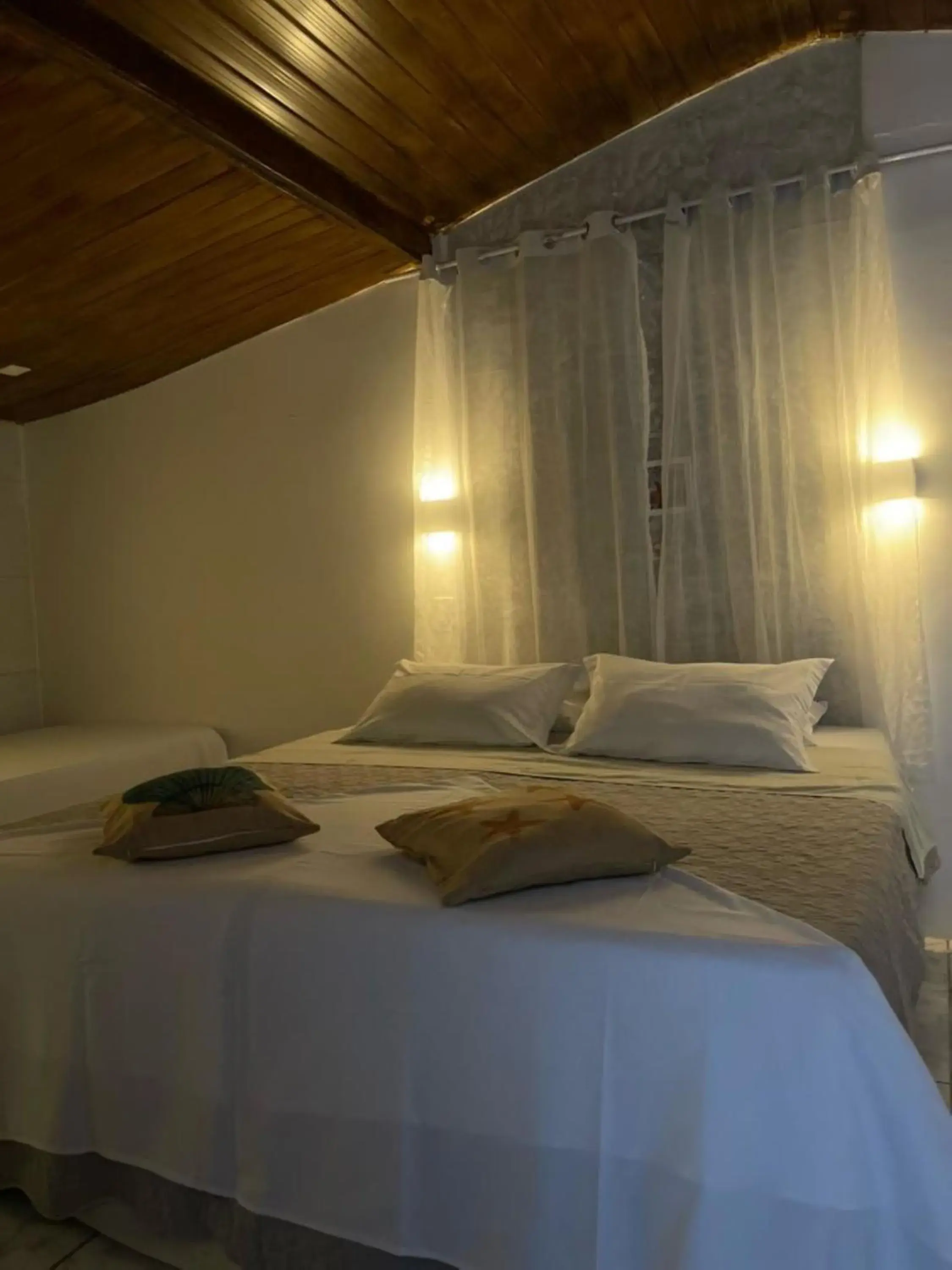 Quadruple Room in Pousada Portal dos Golfinhos Quadruple Room in Pousada Portal dos Golfinhos