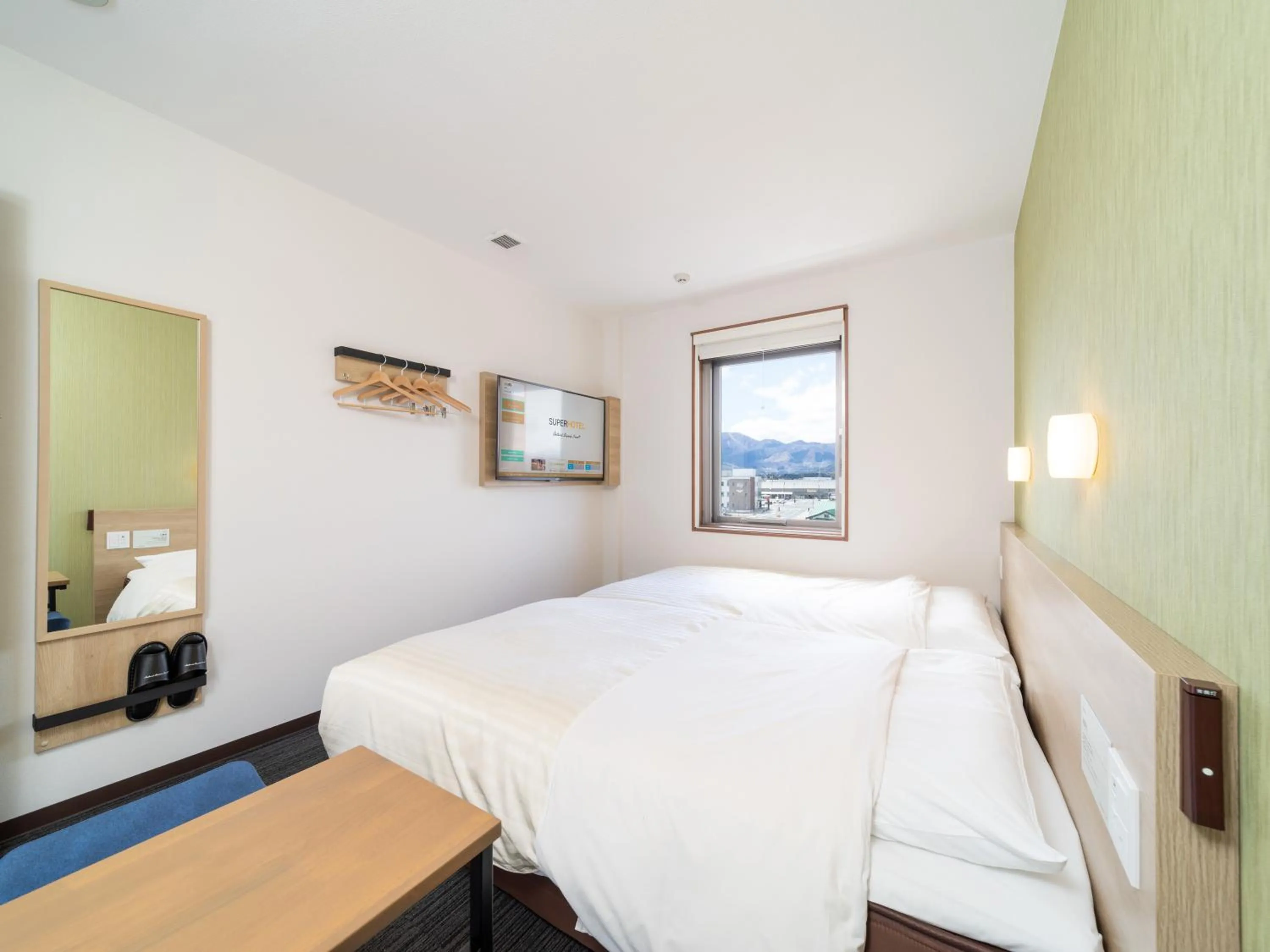 Bed in Super Hotel Yahaba Station East Exit