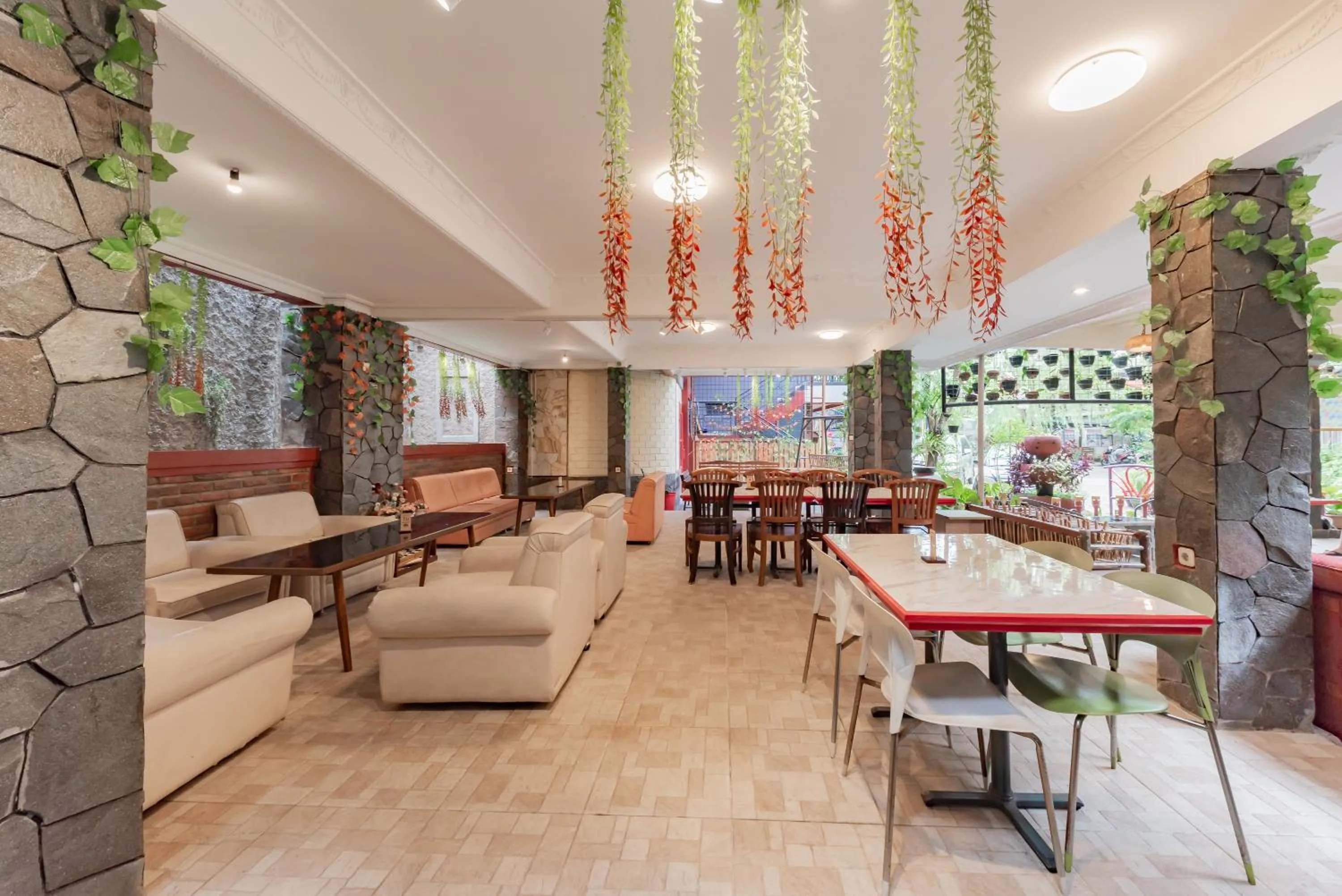 Seating area in Urbanview Hotel Villa Surya Bandung