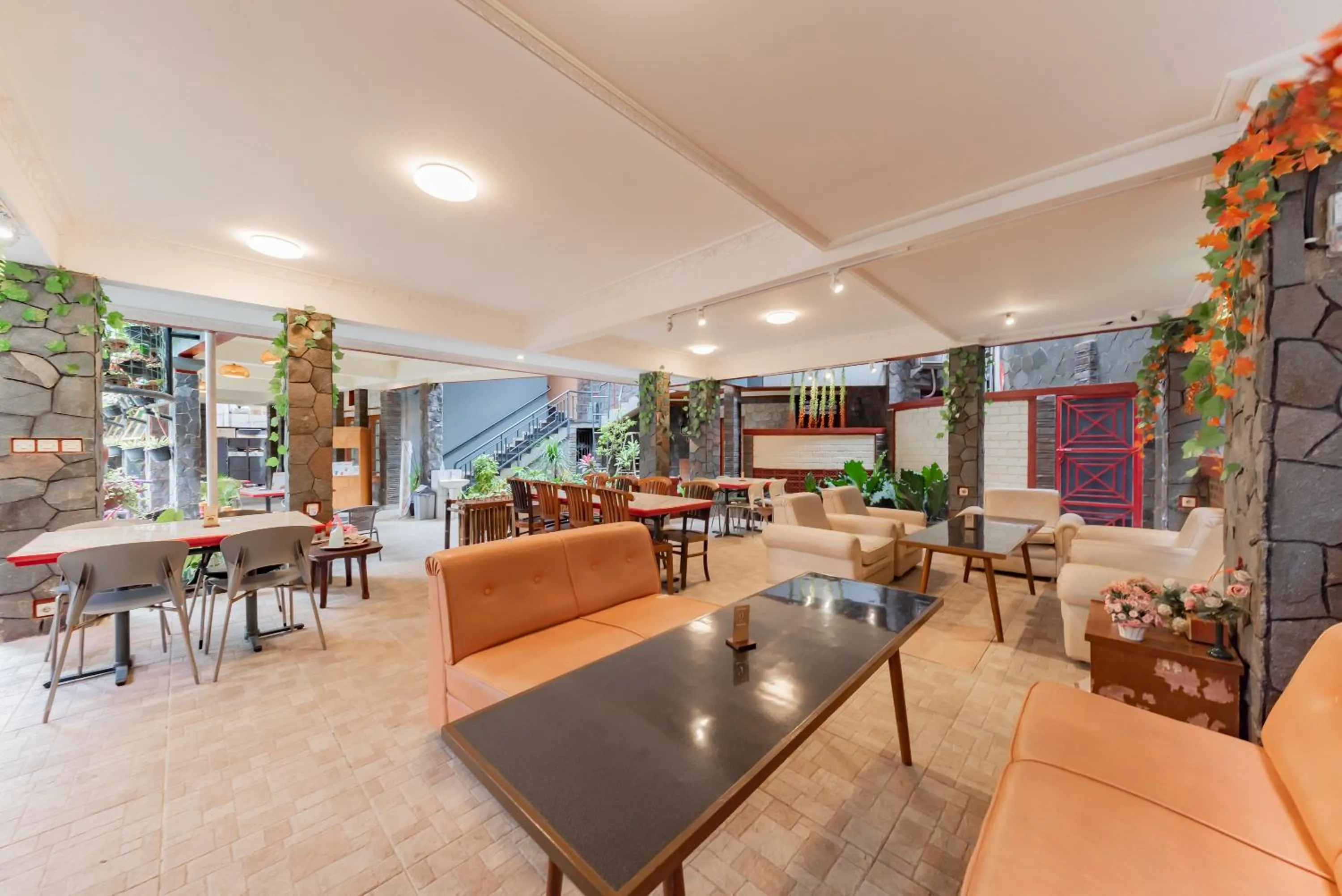 Seating area in Urbanview Hotel Villa Surya Bandung