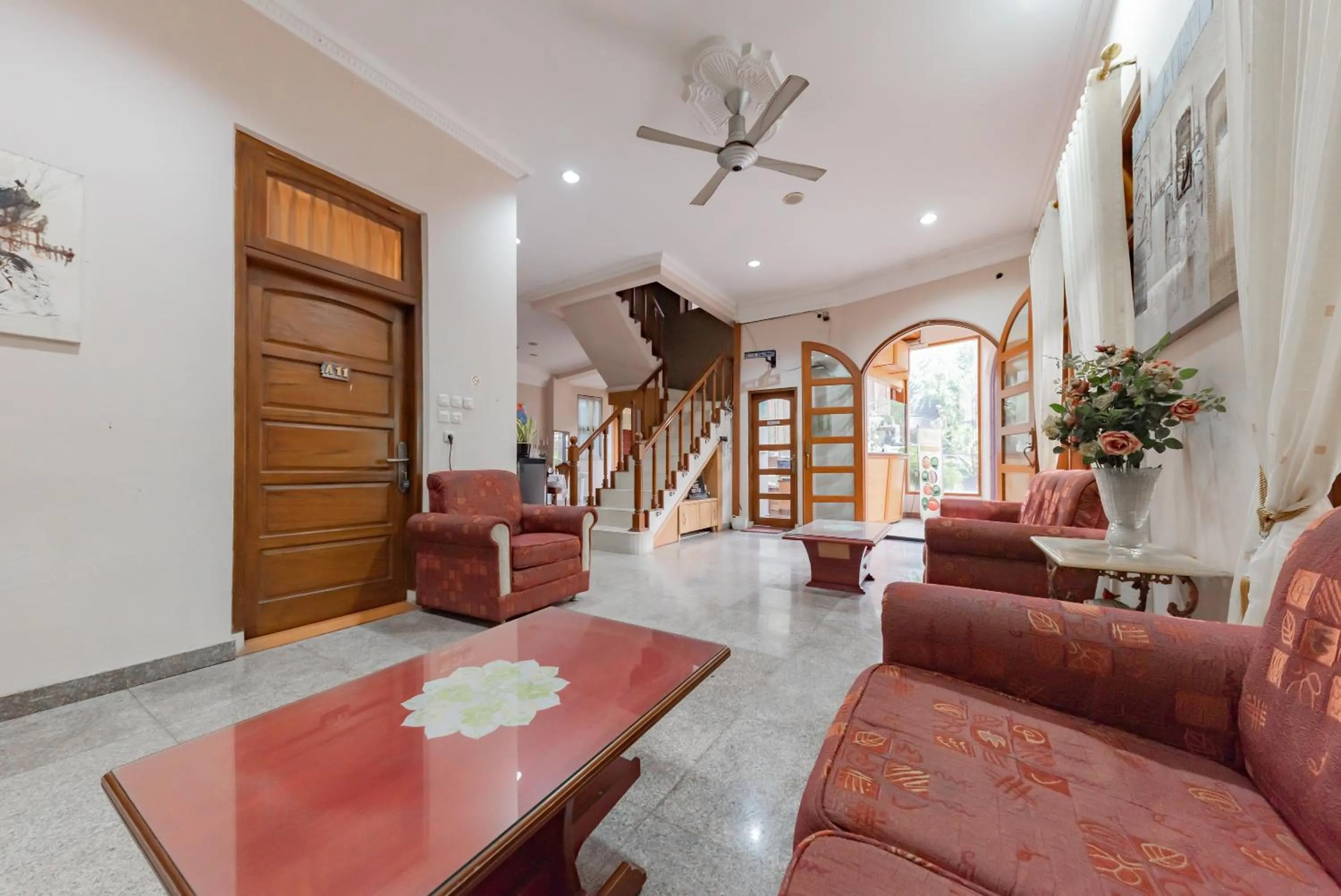 Seating area in Urbanview Hotel Villa Surya Bandung