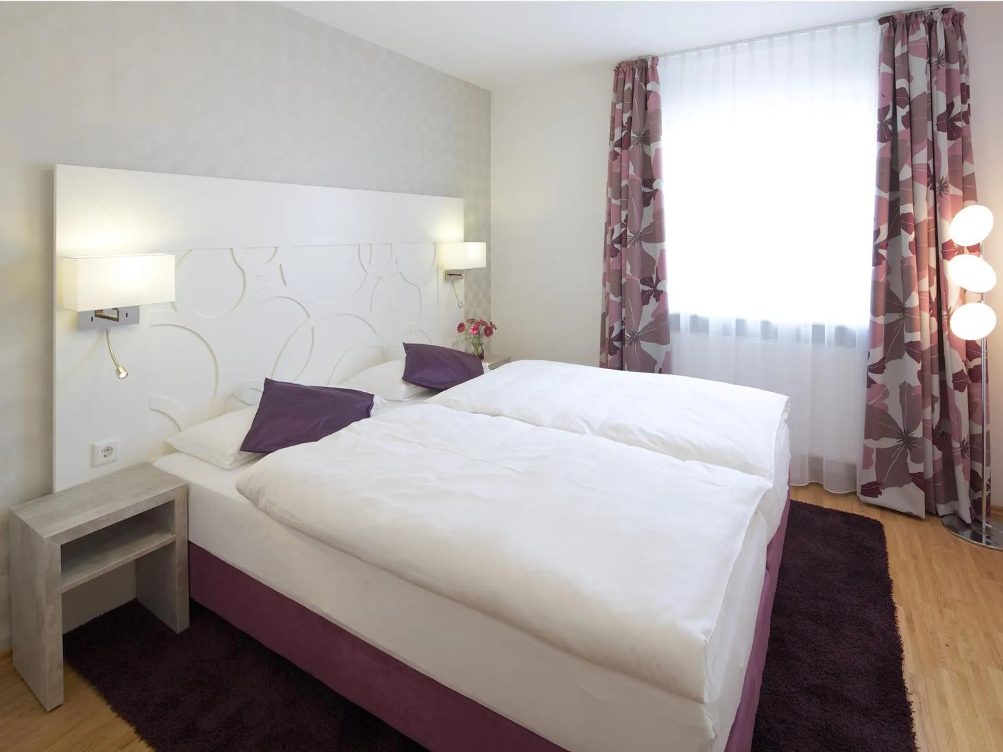 Bed in Hotel Karolinger Hof