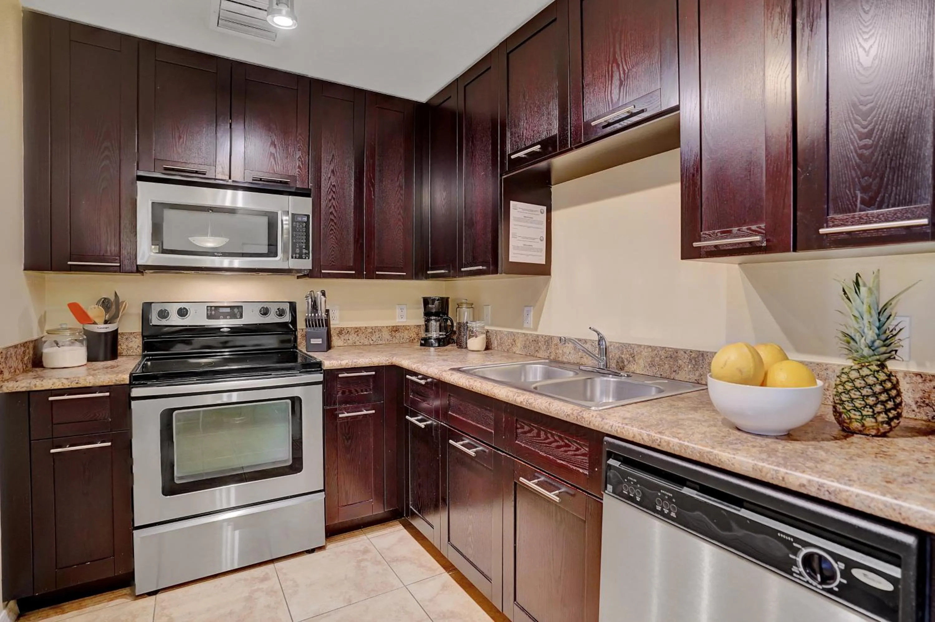 Kitchen or kitchenette in Dharma Home Suites South Miami at Red Road Commons