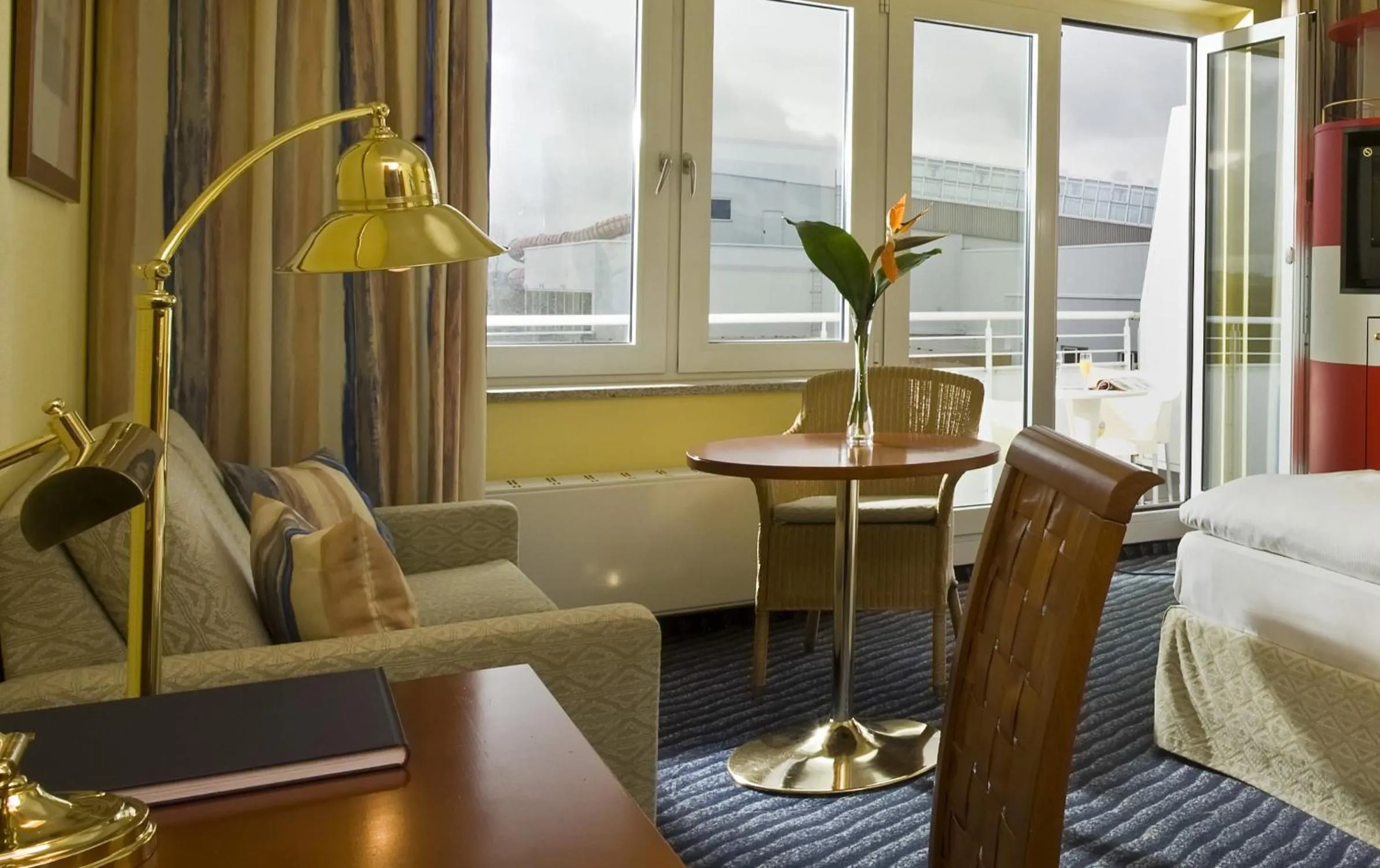 Seating area, Bed in Wyndham Stralsund HanseDom